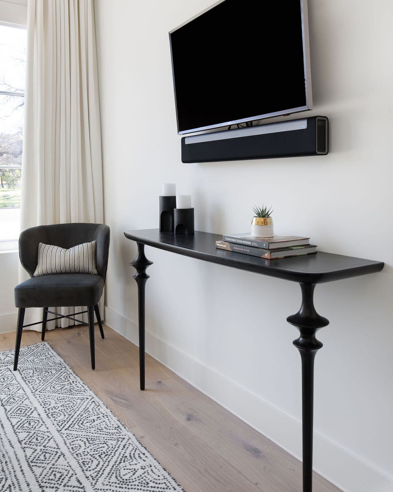 Sometimes two legs are better than four. This wall mounted console was the perfect fit, allowing more walk space in front of the bed while also serving as a functional piece to anchor the wall mounted TV so it didn&rsquo;t look &ldquo;floating&rdquo;