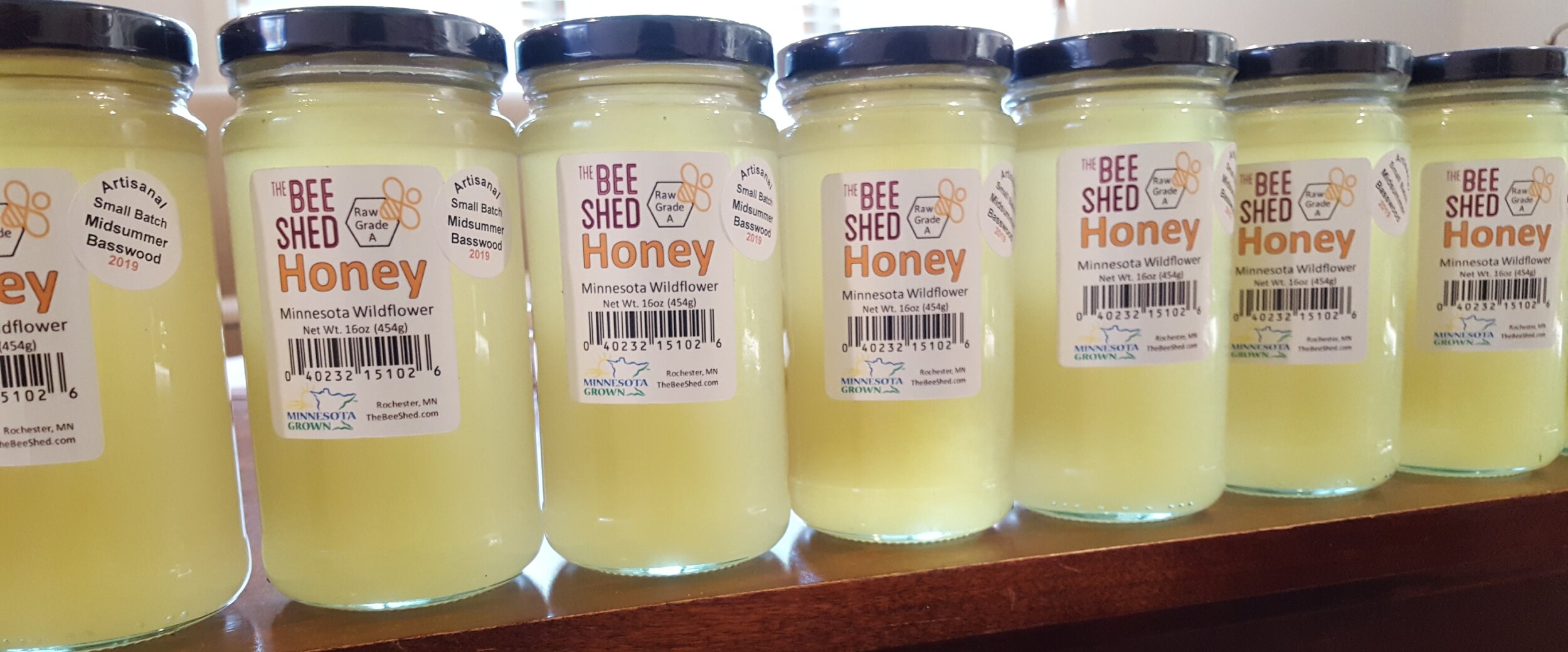 Jars of The Bee Shed's honey on a shelf