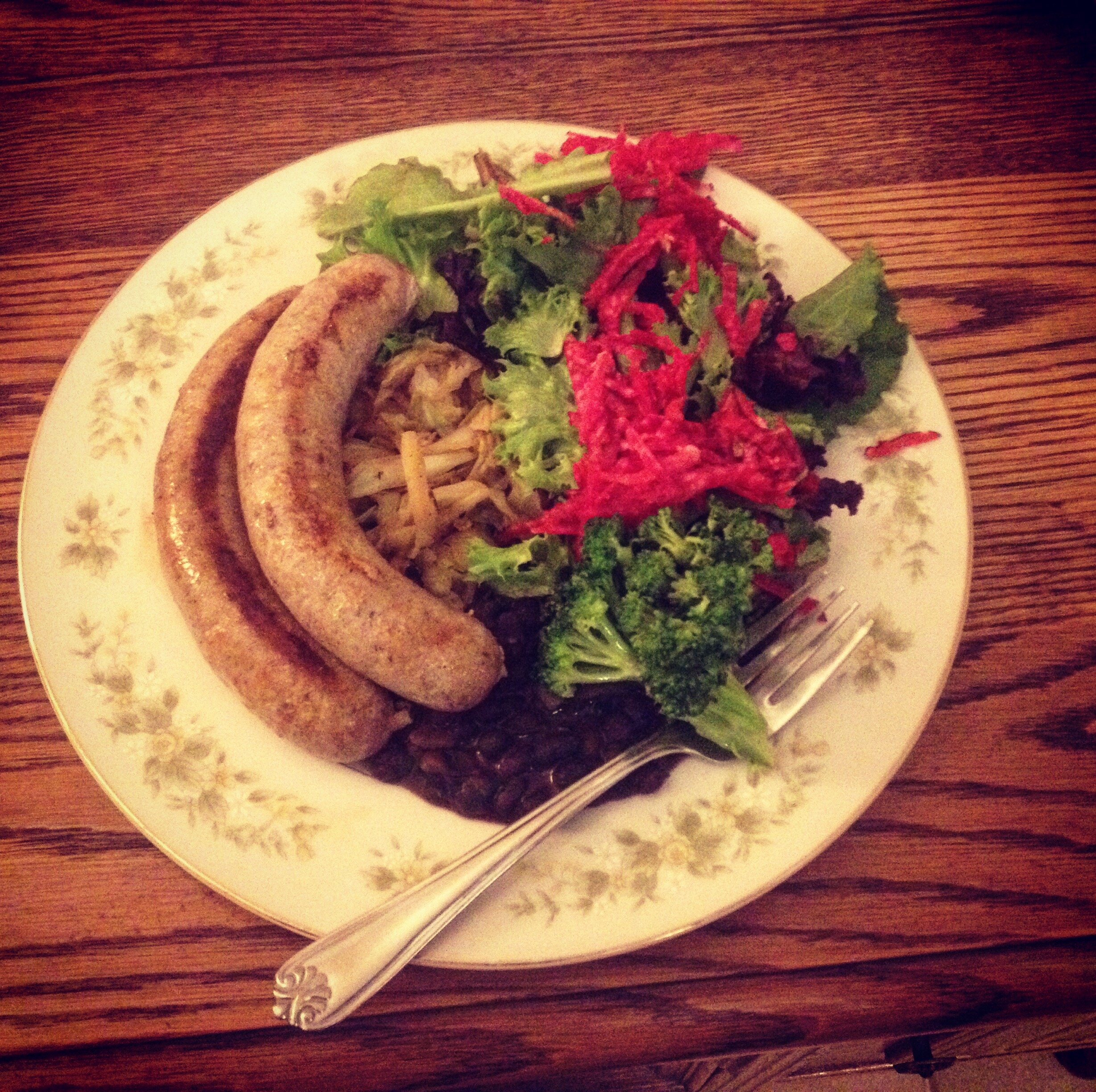 plate with brat and salad