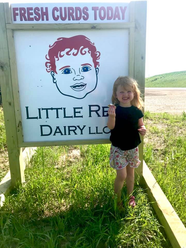 girl next to sign