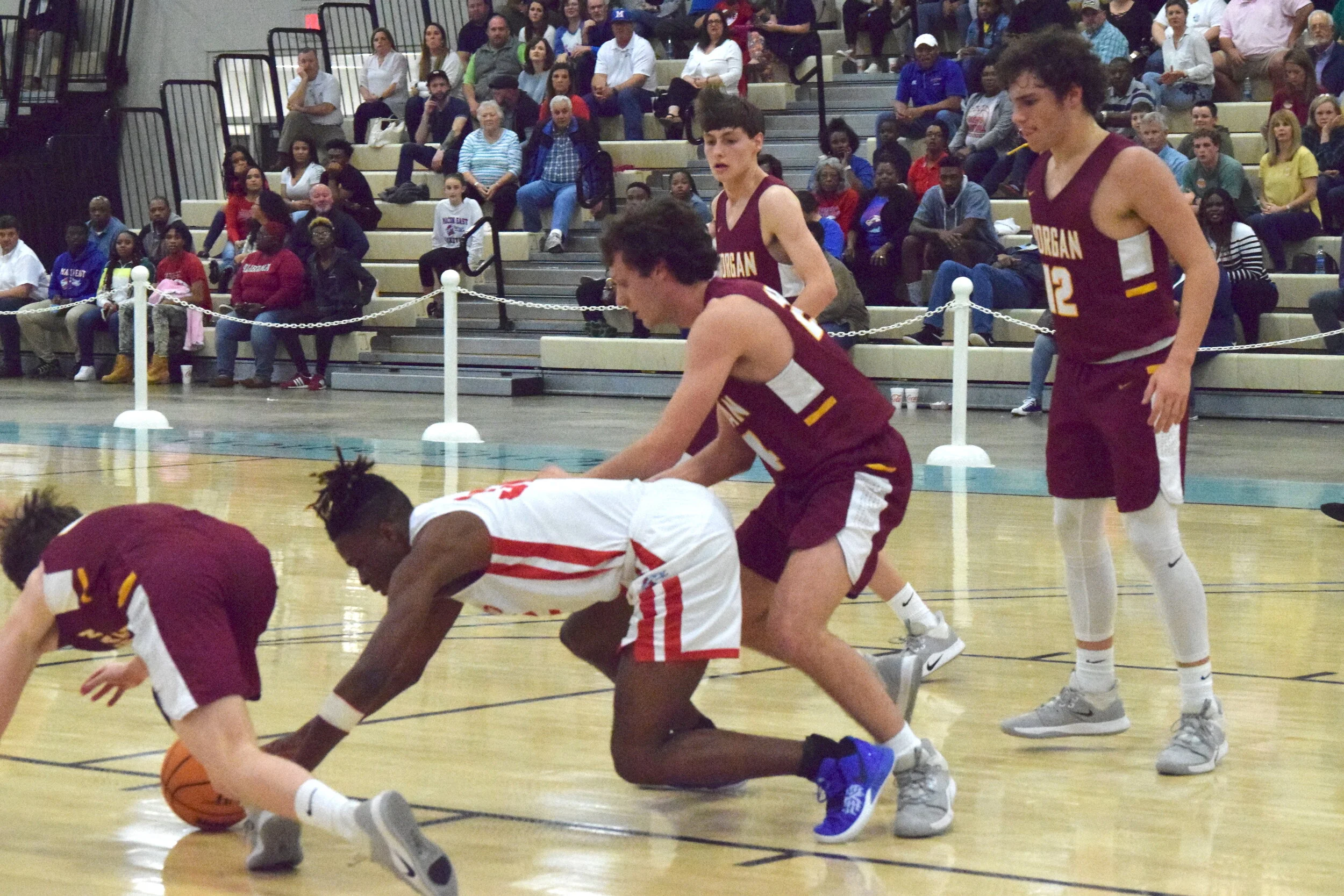 Morgan's Milam Turner, Macon's Javen Augustus scramble for ball.JPG
