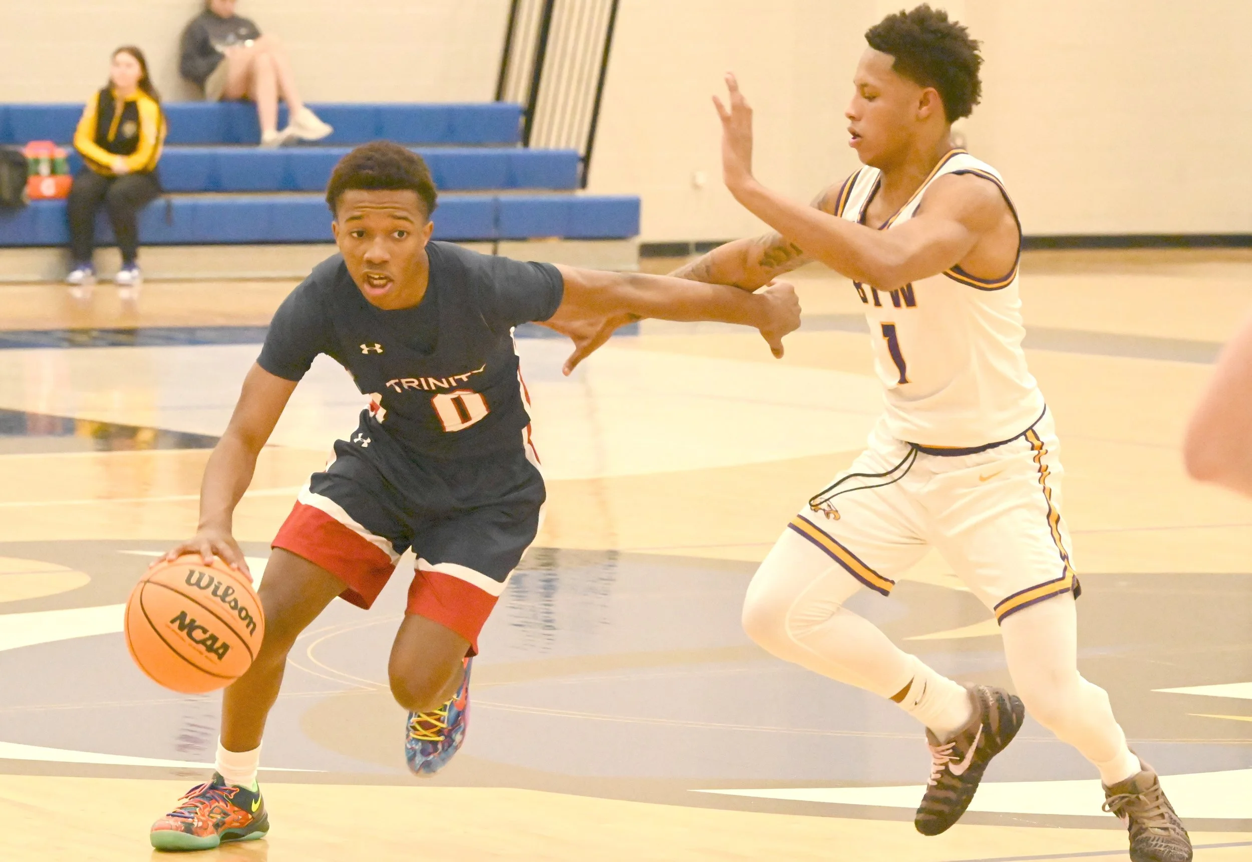 Trin Kamari Hutson tries to get around BTW James Henderson.JPG