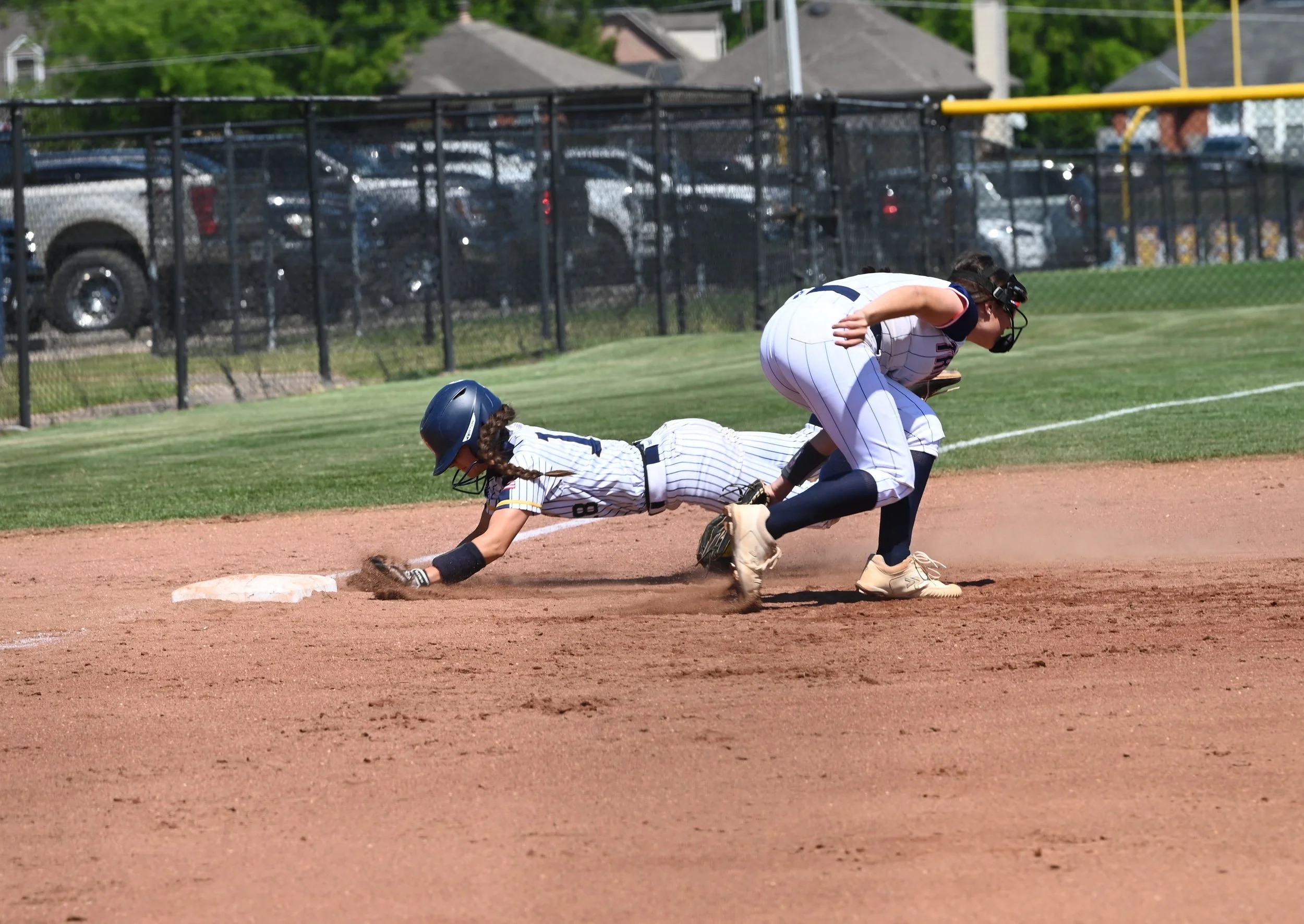 SJ Camryn Caldwell reaches third on wild pitch as Layla Pelt applies tag.JPG