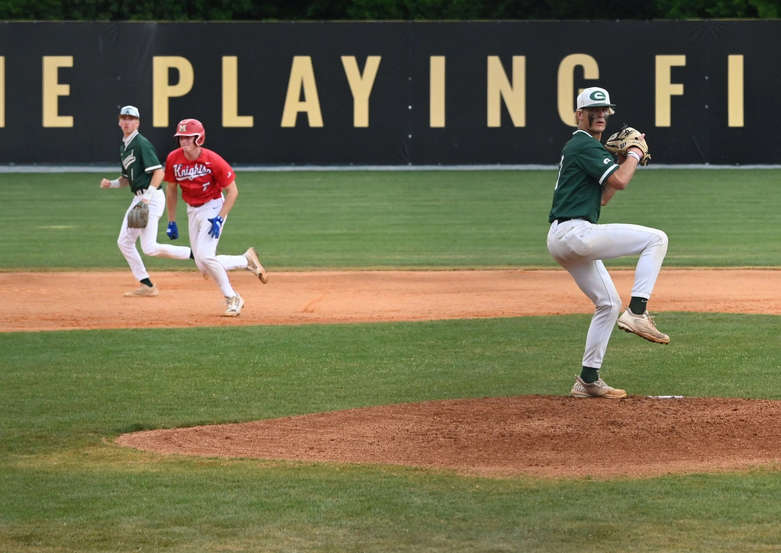 Edgewood Colten Lashley throws as Jackson Todd steals third.JPG