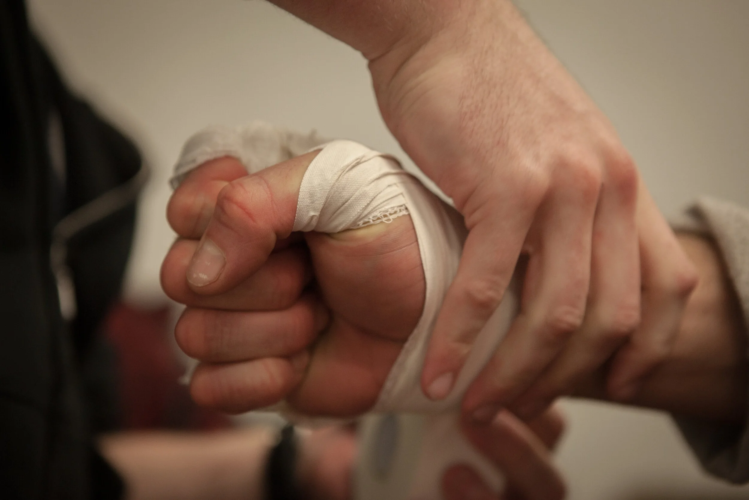  An MMA fighter’s hand is wrapped prior to the match. 