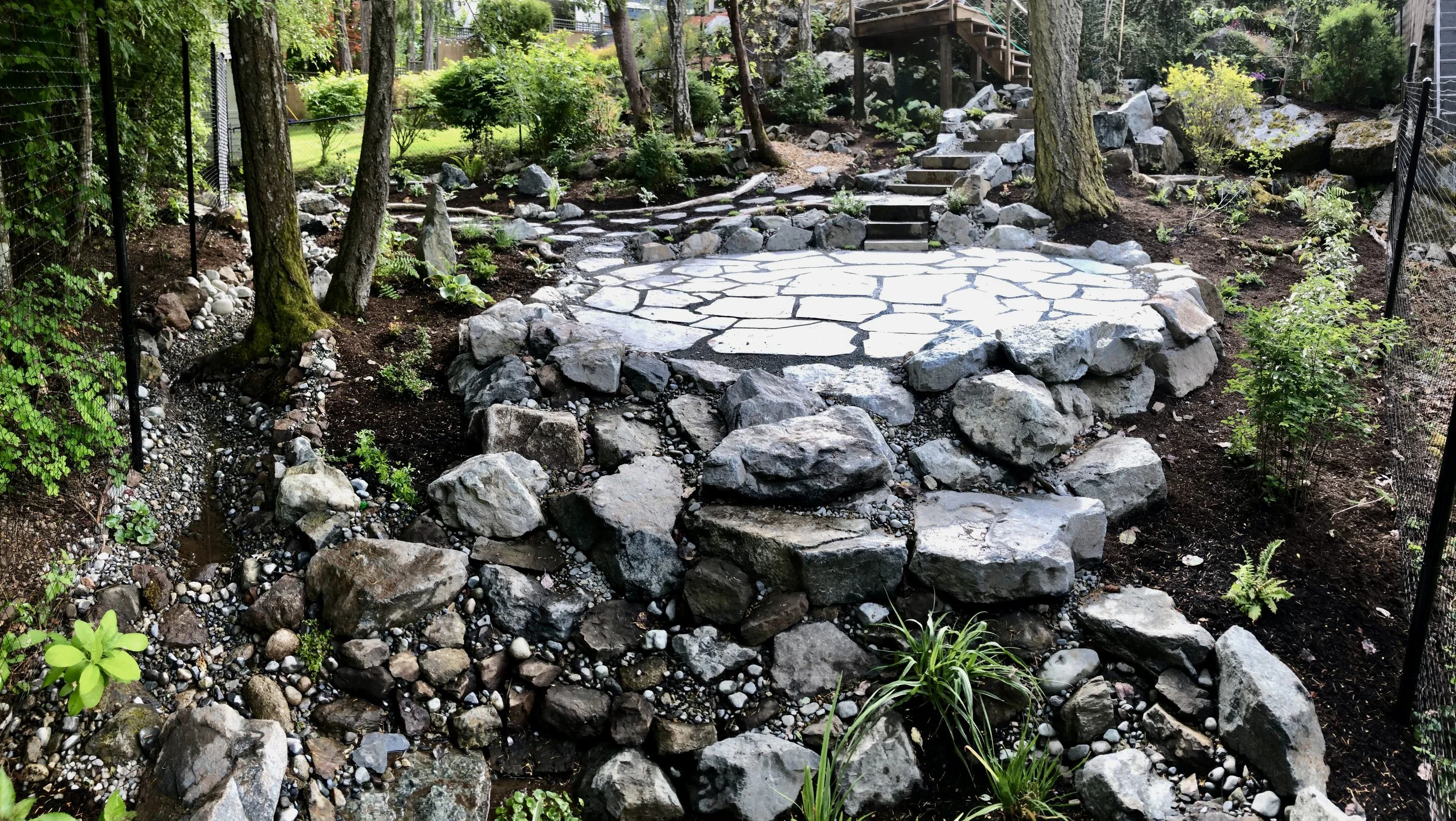 edible-landscape-stone-patio-raingarden-backyard-shade.jpg