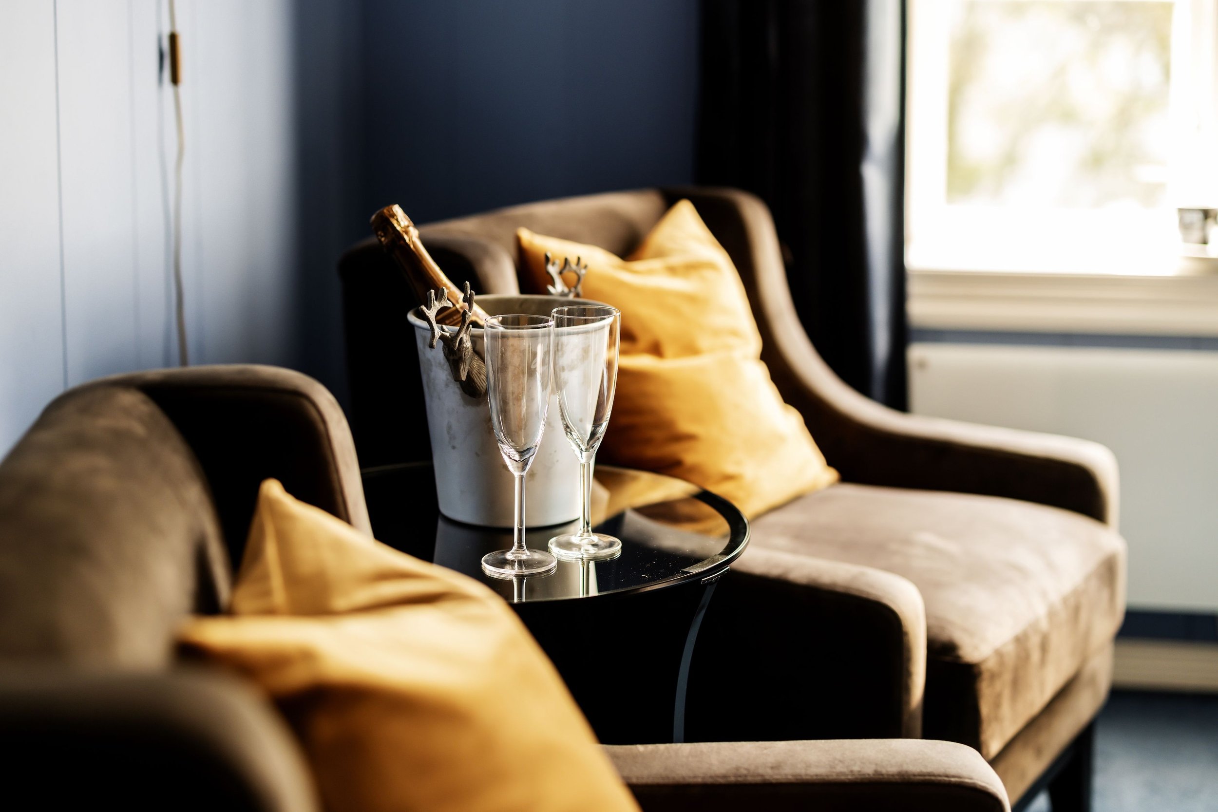 Champagne bucket with glass and good drink.