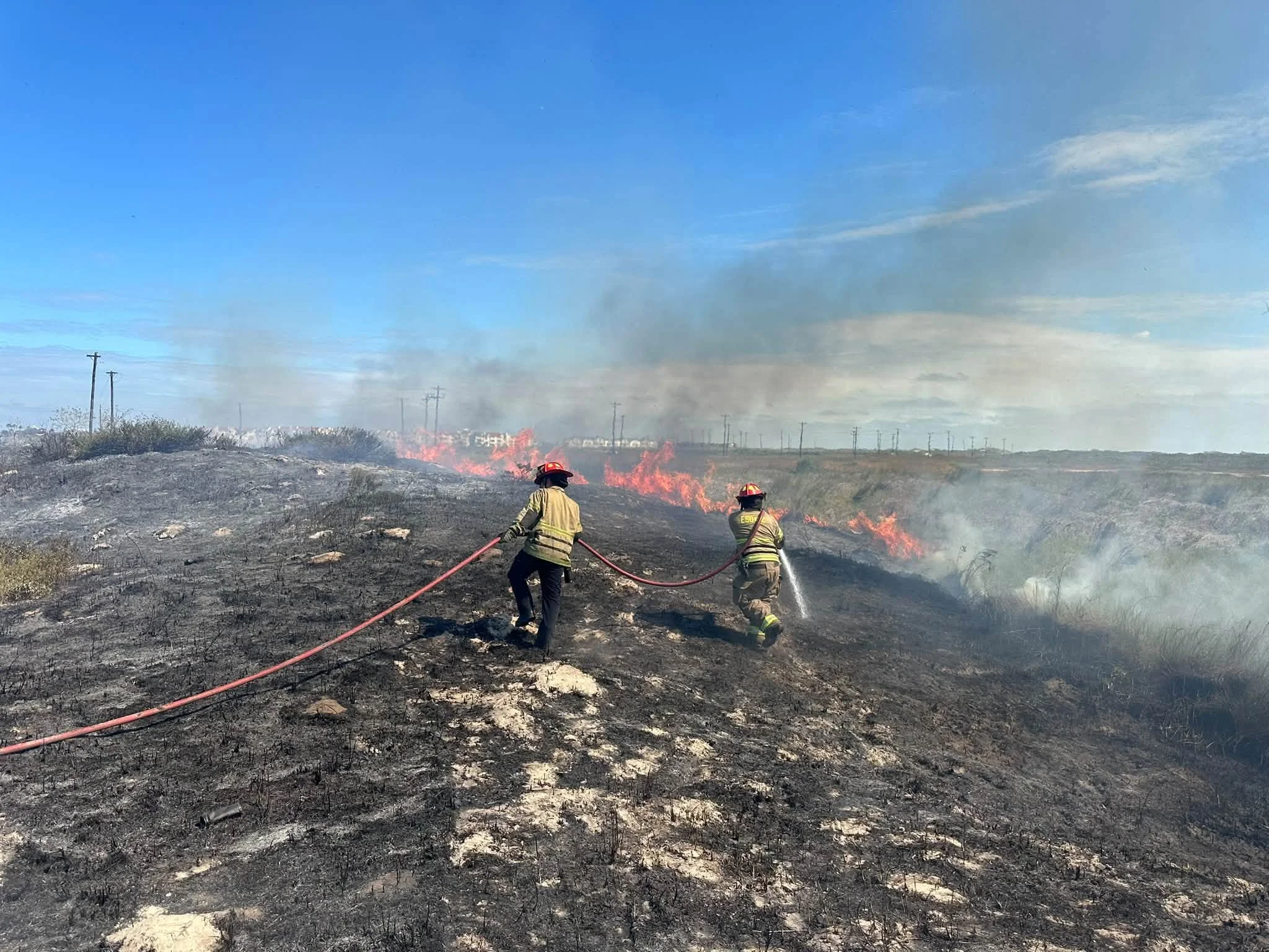 Grass Fire in Dunes Near Park Road 22 Contained by Fire Crews