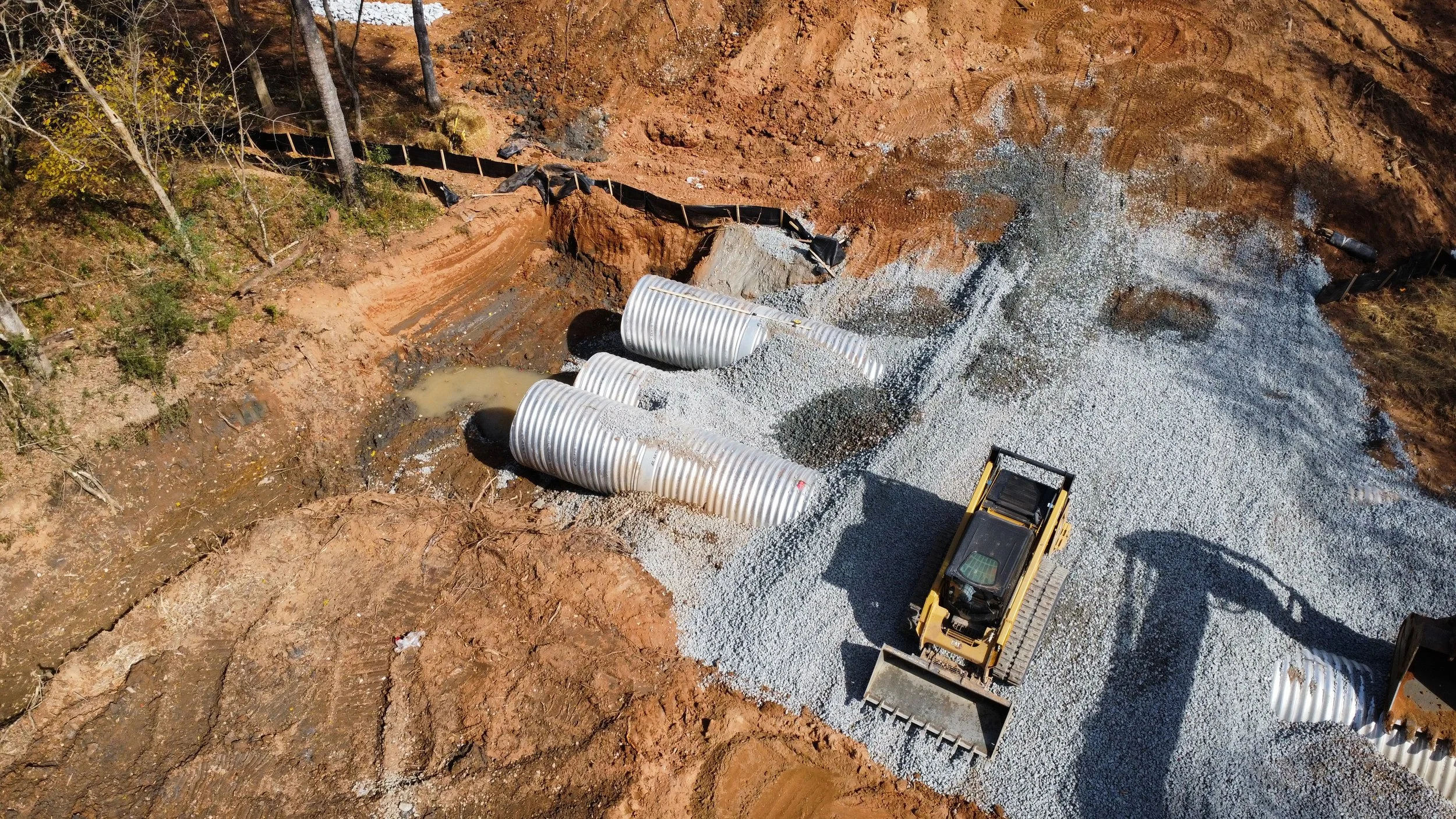 Triple metal culvert install under driveway