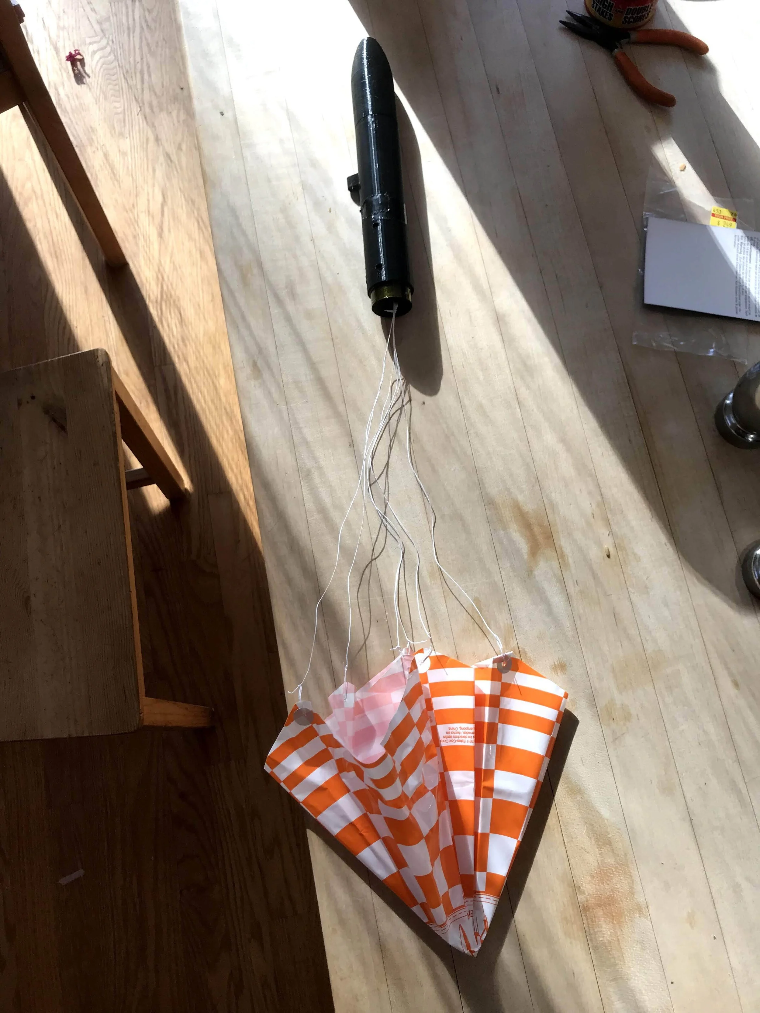 Parachute attached to the rocket fuselage