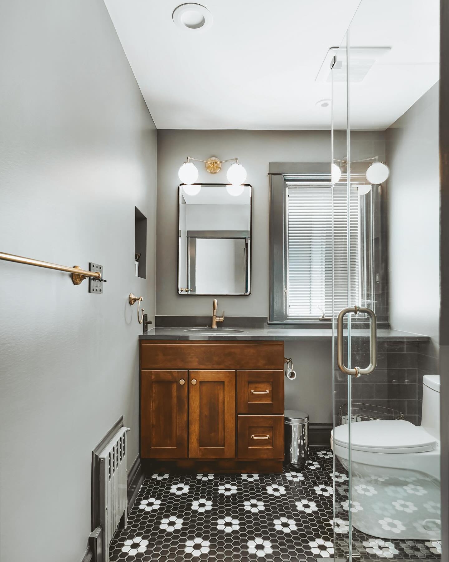 A black tile bathroom accented with natural wood creates a striking contrast, blending modern elegance with organic warmth. The dark tiles provide a sleek backdrop while the natural wood adds a touch of earthy sophistication
#magdainteriors 

🔨 @4ev