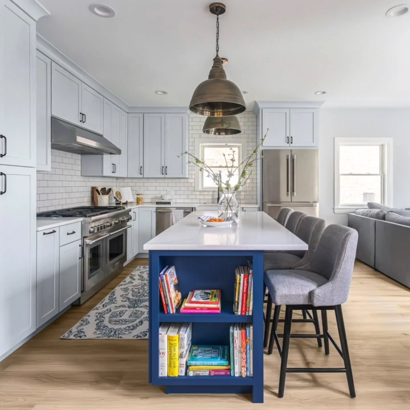A kitchen designed for the book lover - the kind who starts the day with a slow sip of coffee and a chapter or two. Wrapped in the soft glow of blue, this space invites you to pause, breathe, and settle into your favorite ritual. Here, design doesn't