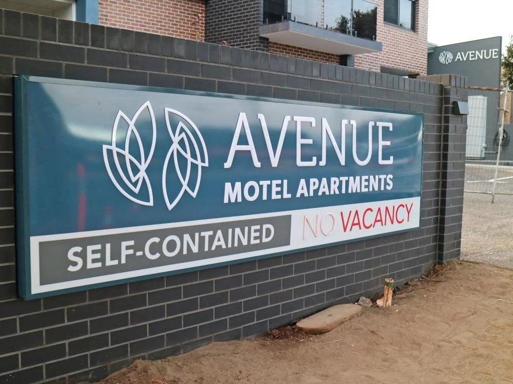 Illuminated-Lightbox-Signs-On-Time-Avenue-Motel.jpg