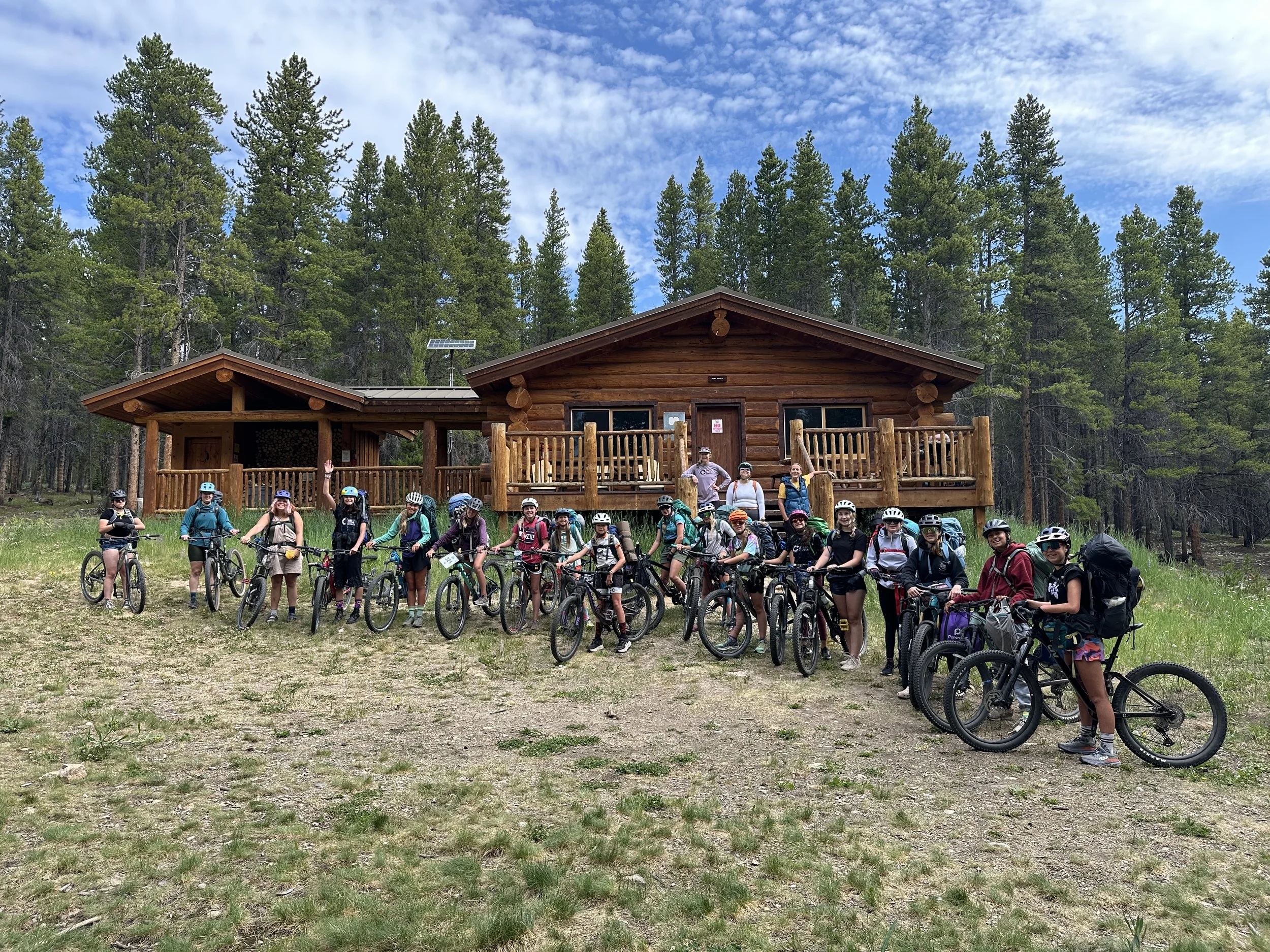 TCE Riders in front of their awesome hut!