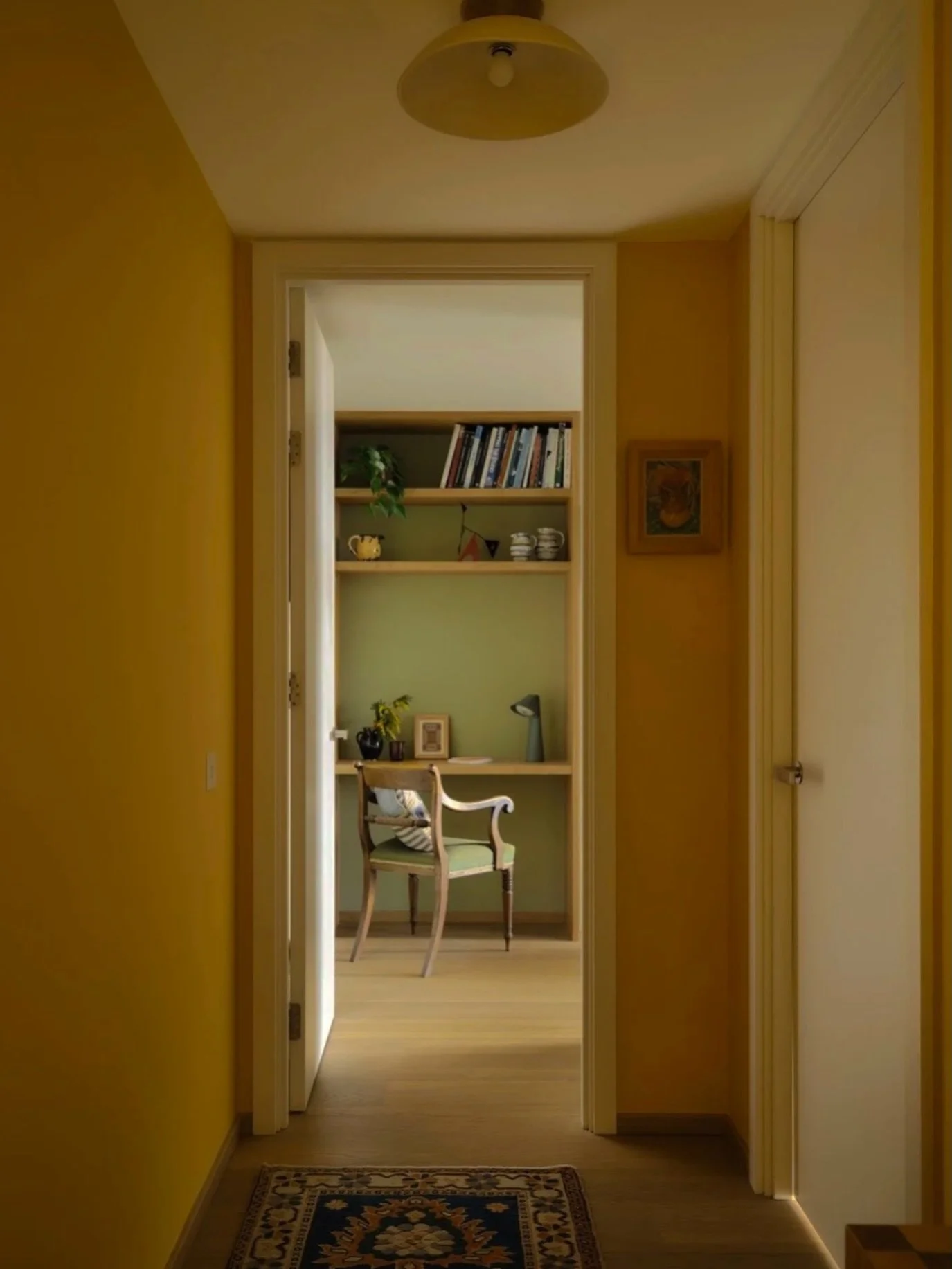 A sunshine yellow hallway leading to a bedroom desk nook 🌼
&bull;
A hallway is generally a dominant part of the overall footprint of a home- it welcomes you when you return after a long day and you continuously move through it throughout the day. 
T