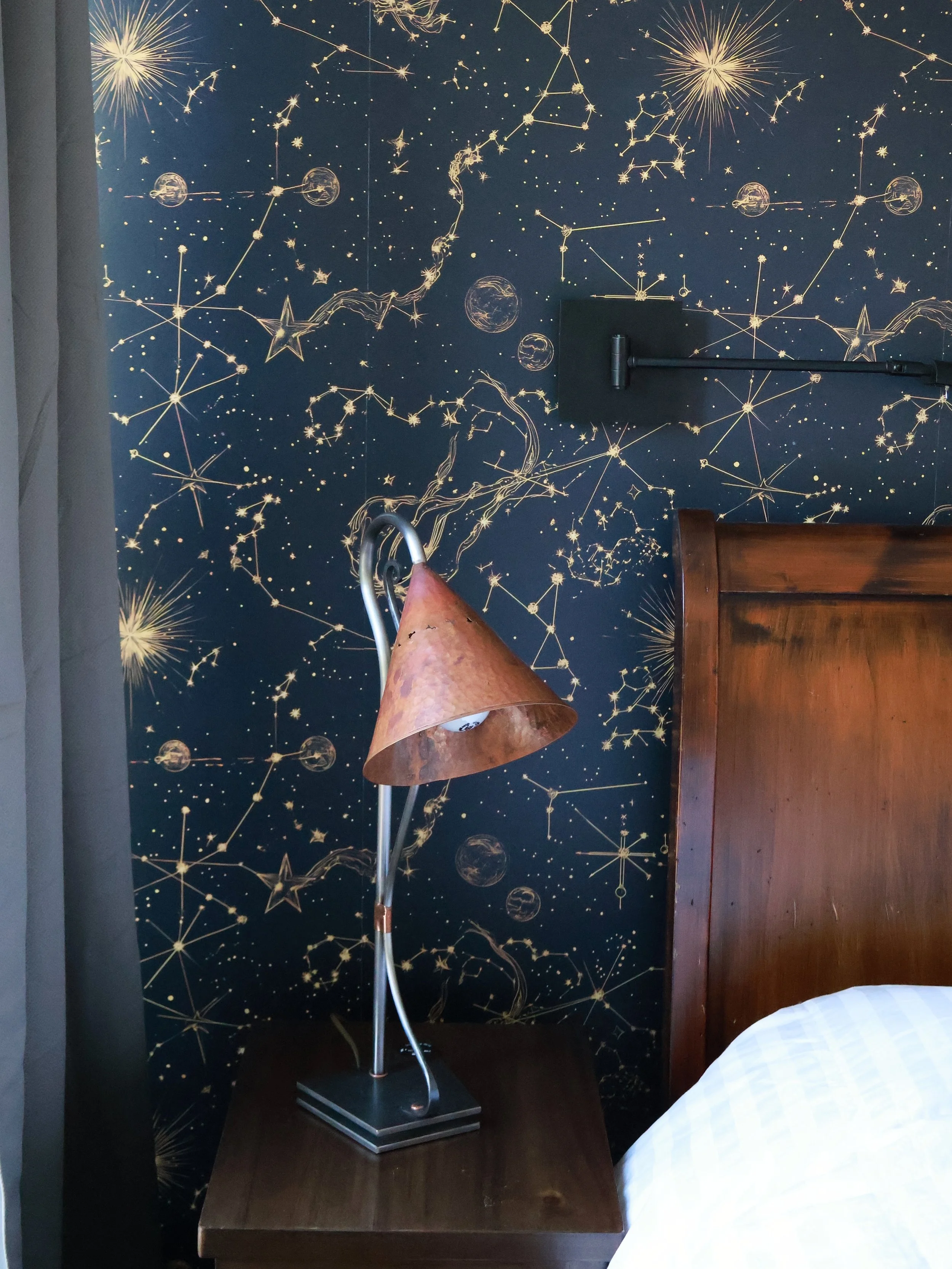 The stars aligned perfectly for this primary bedroom. 🌙 🌌🌟

This celestial-inspired wallpaper brings depth, drama, and personality into this bedroom. 🛏️ 

At Malooly Homes, we love creating spaces that feel completely unique to the homeowners liv
