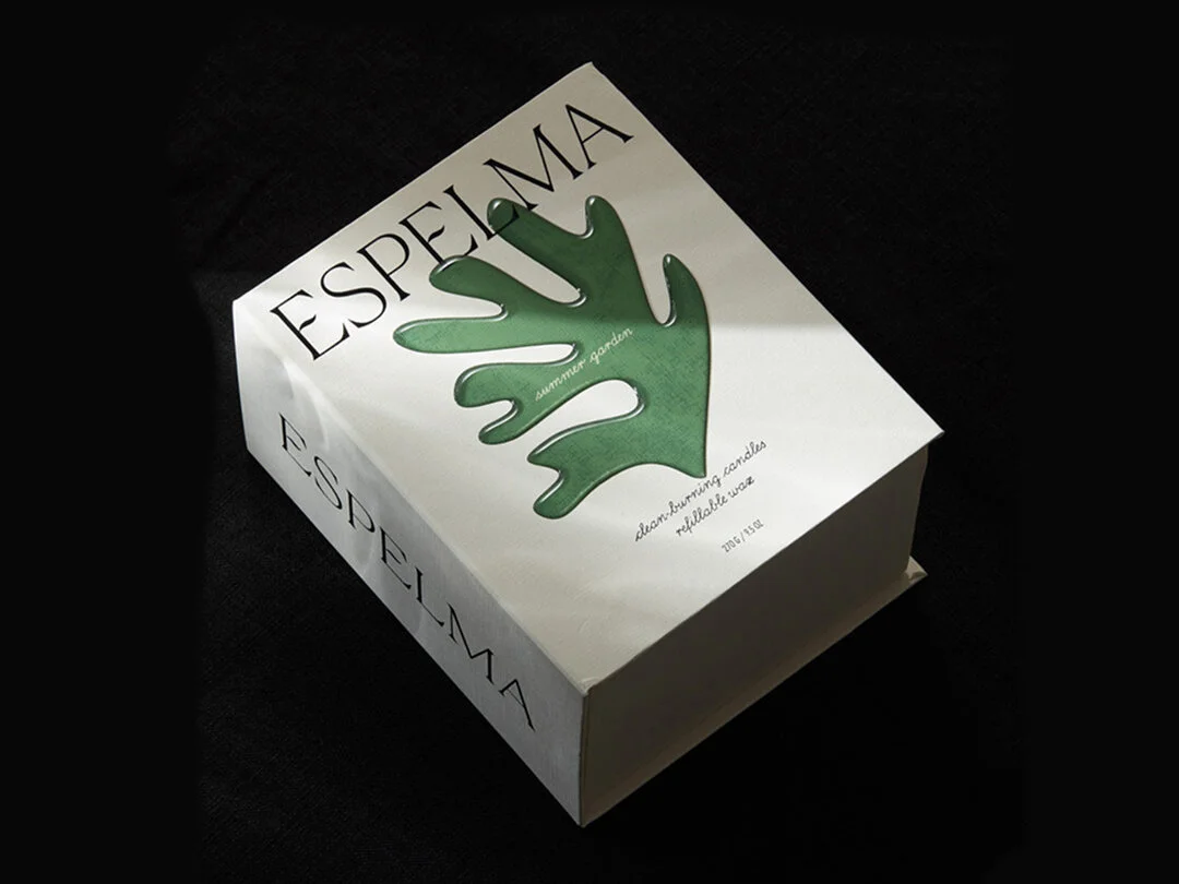 The subtle and tactile Espelma packaging design is lit