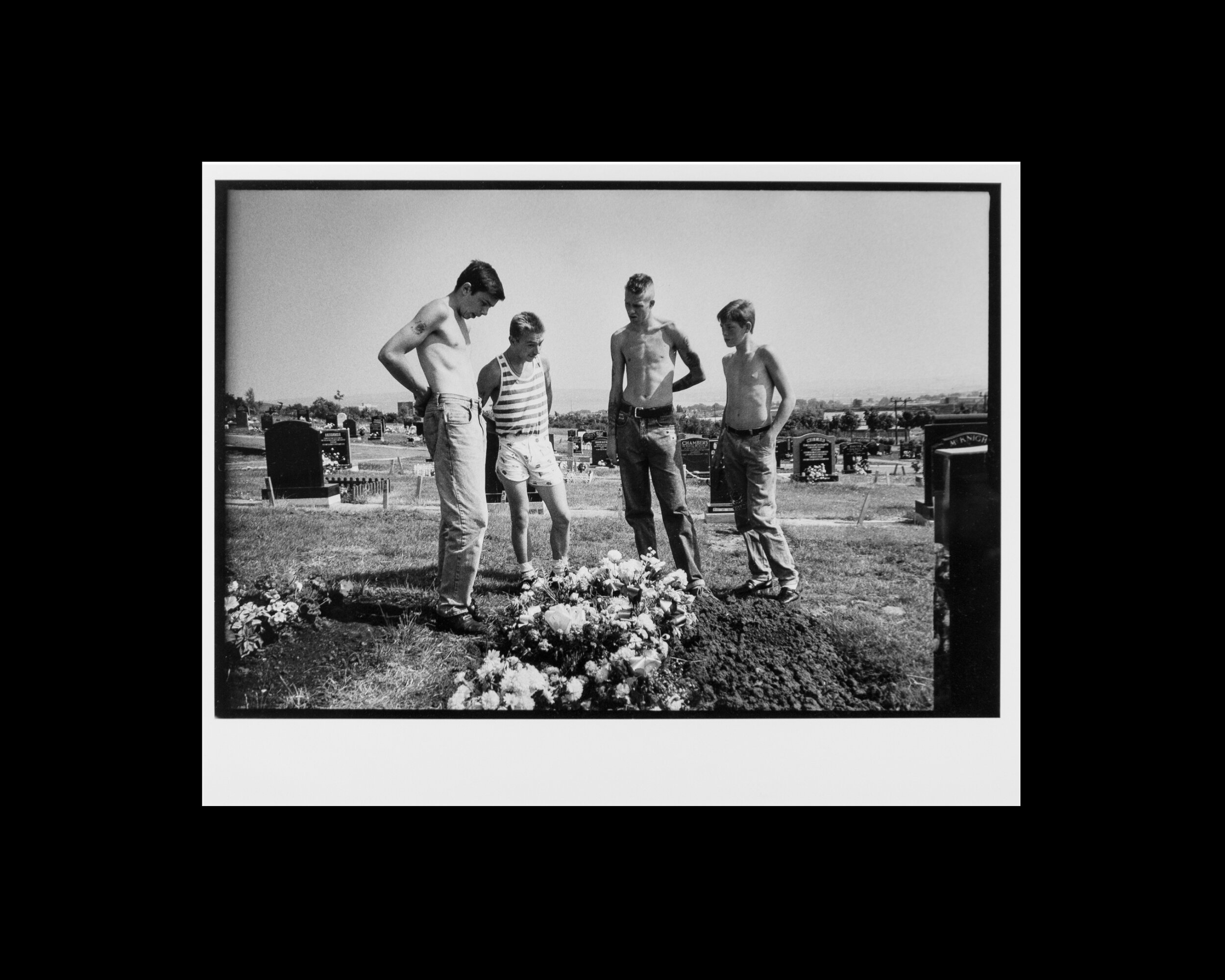  Teenagers from Belfast's working class Protestant neighborhood of Tiger's Bay visit the grave of a fallen friend in Belfast, Northern Ireland. 1989 