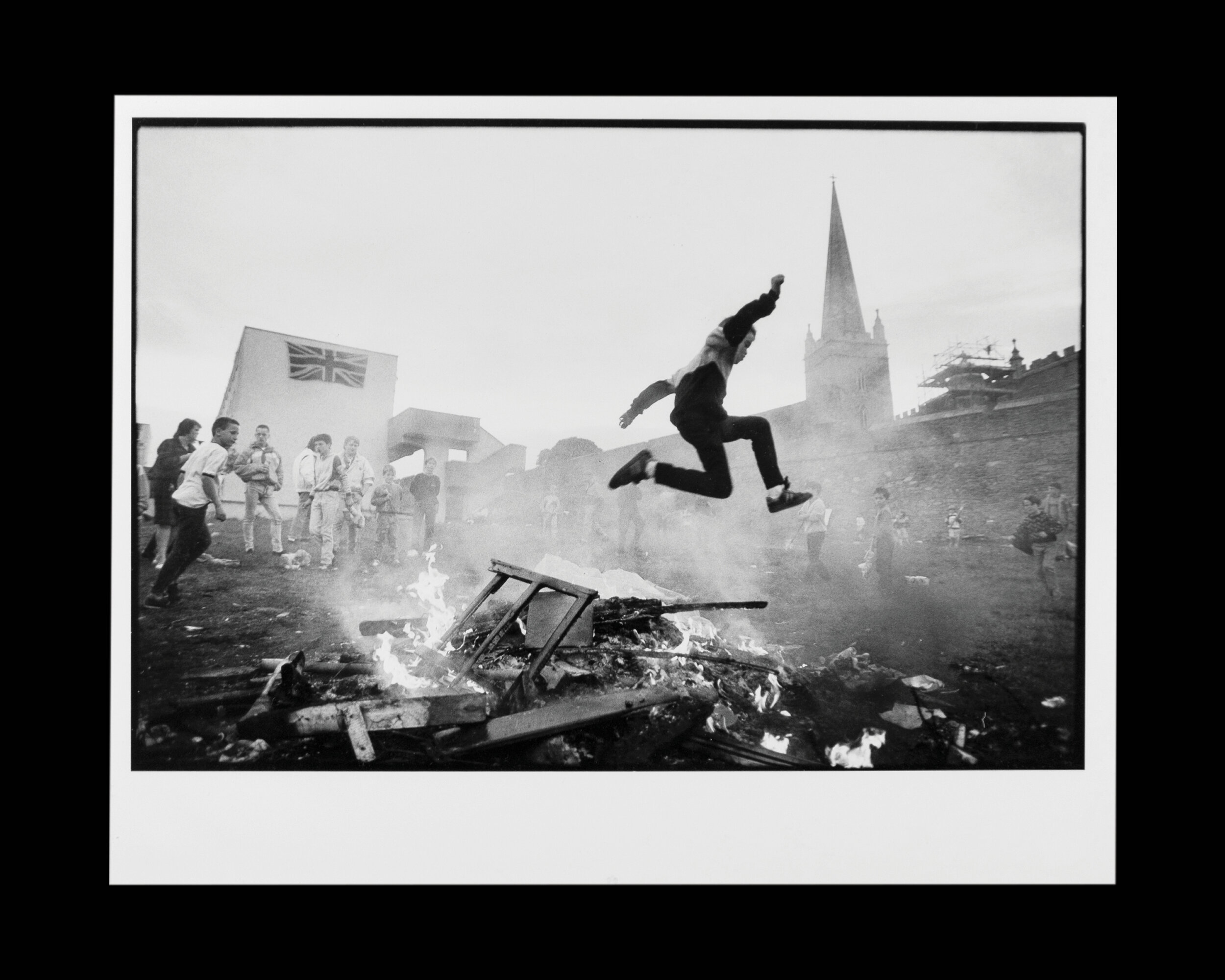  Children play around an impromptu bonfire in The Fountain, a Loyalist housing estate in Londonderry, Northern Ireland. 1989 