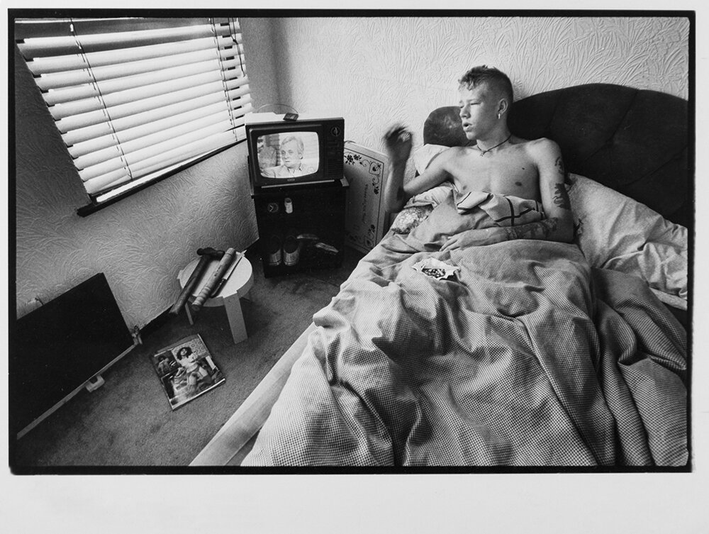  Brian Crothers, a teenager from Belfast's working-class Protestant neighborhood of Tiger's Bay, keeps his night-time protection safely within reach in Belfast, Northern Ireland. 1989 