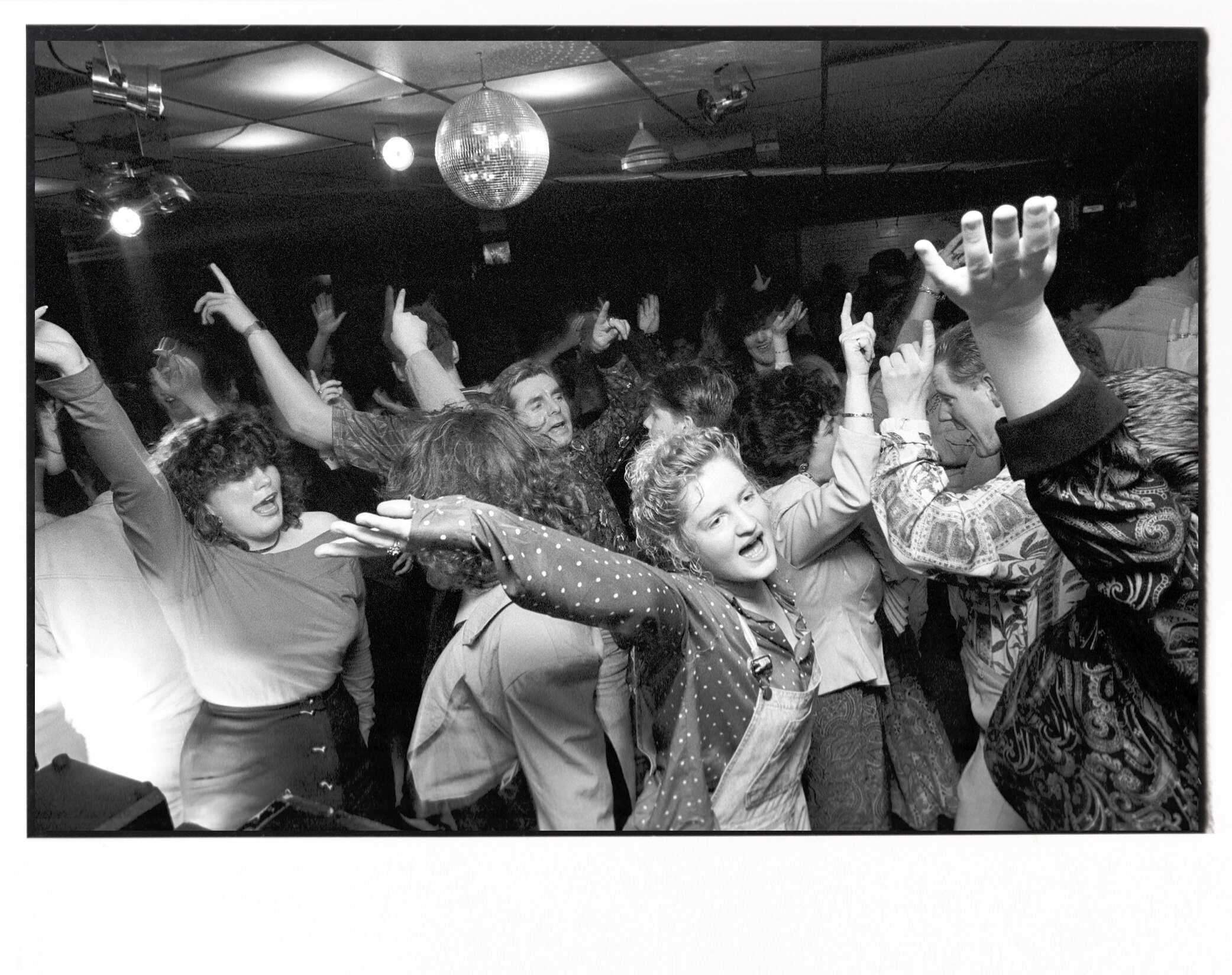  Teenagers dance at a Protestant night club in Belfast, Northern Ireland. 1990 