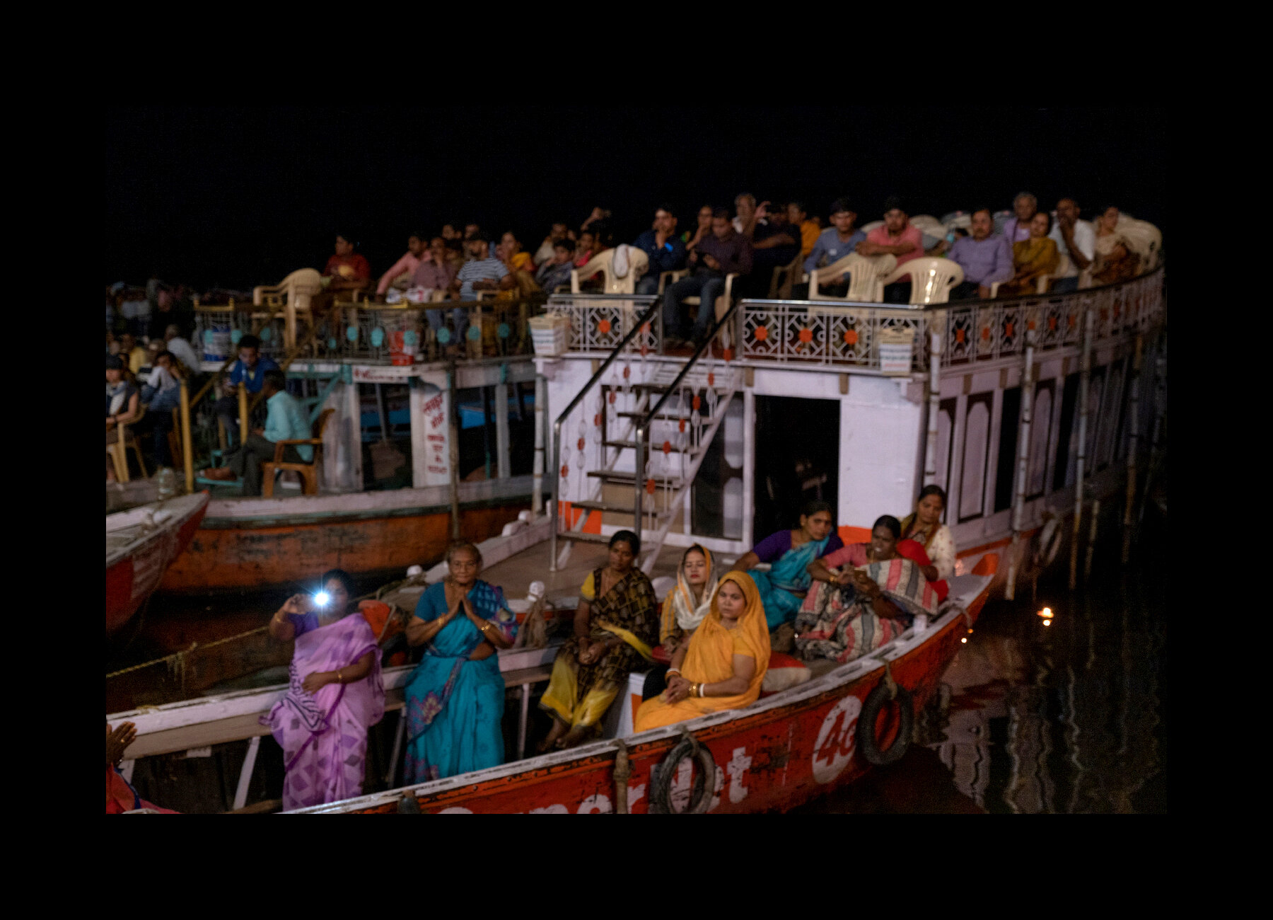  Hindu Puja ceremony for tourists and religious pilgrims at the Dashashwamedh Ghat in Varanasi, India. 2019 