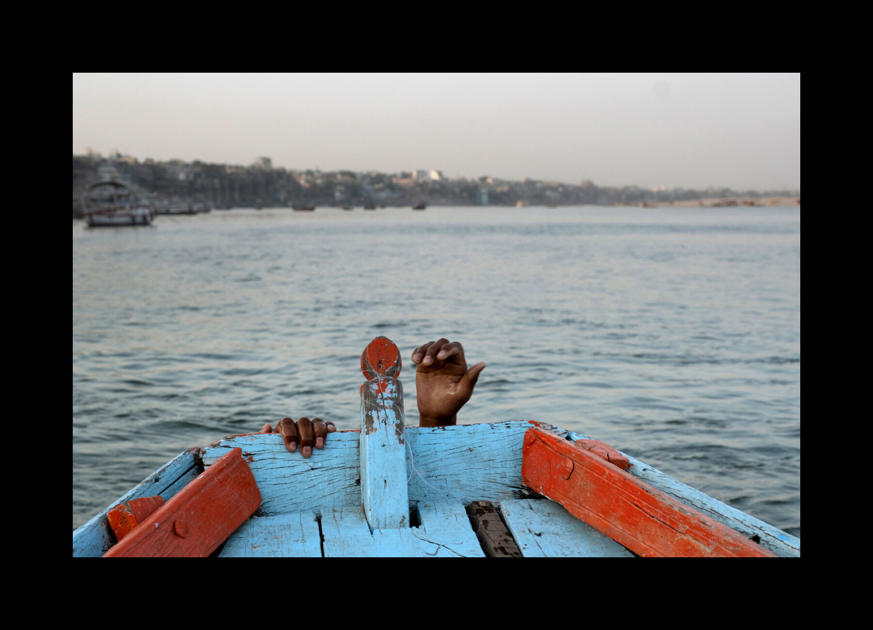  Kids play around some boats in the Ganges River in Varanasi, India. 2019 