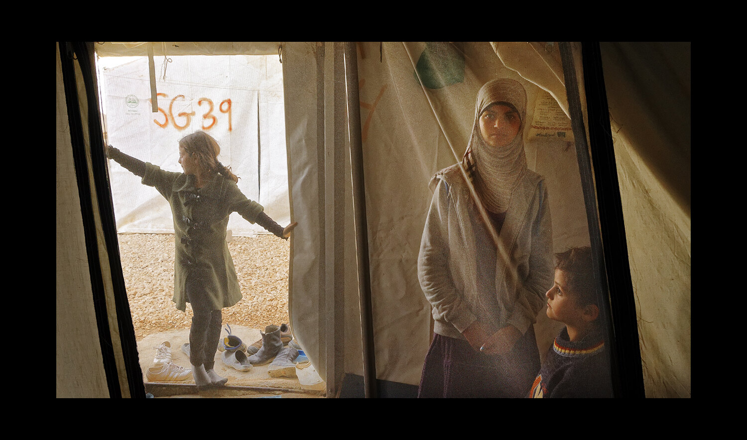  Siblings in their family tent at the Al Za'atri refugee camp for Syrians, near Mafraq, Jordan. 2013 