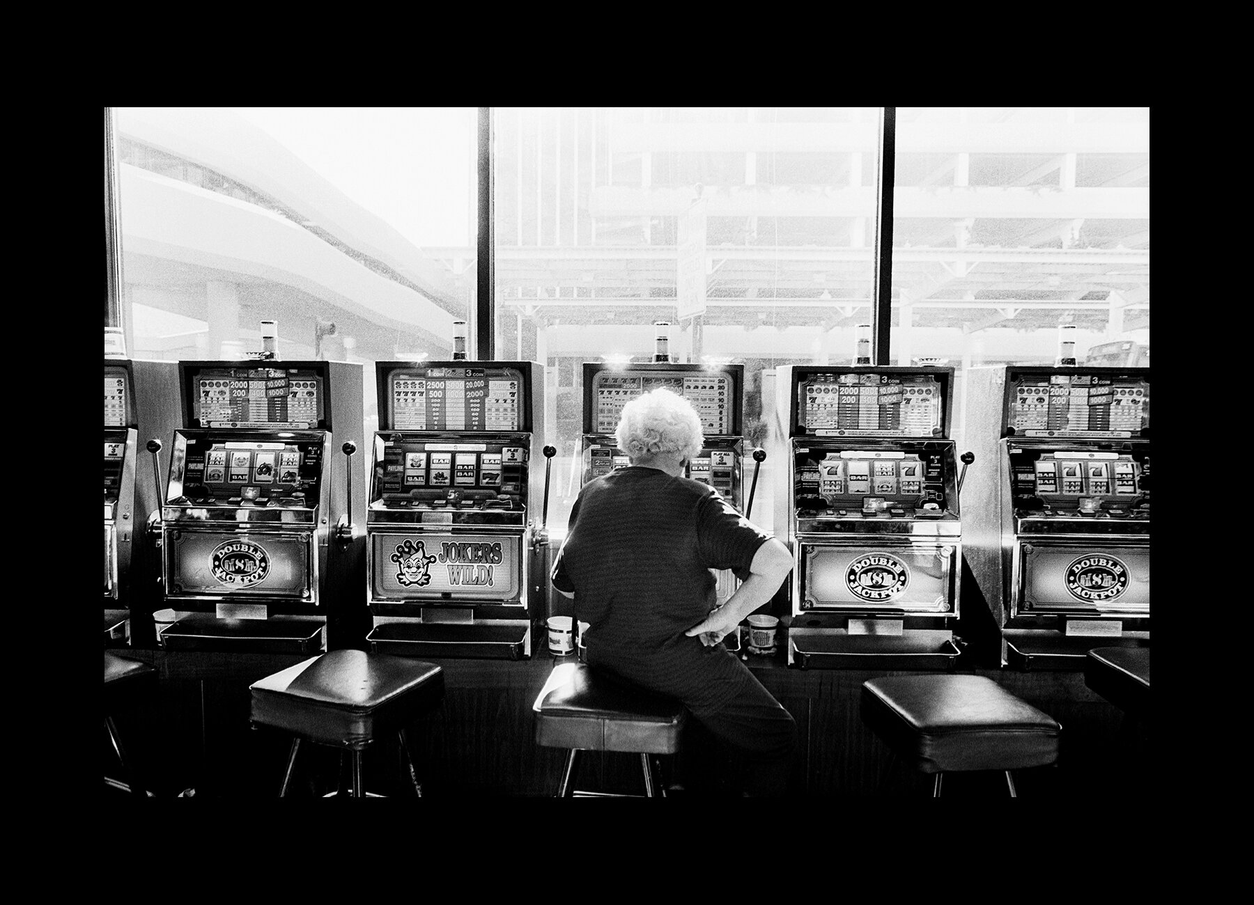  A woman plays on the slot machines on a gaming tour in Reno, Nevada. 2000 