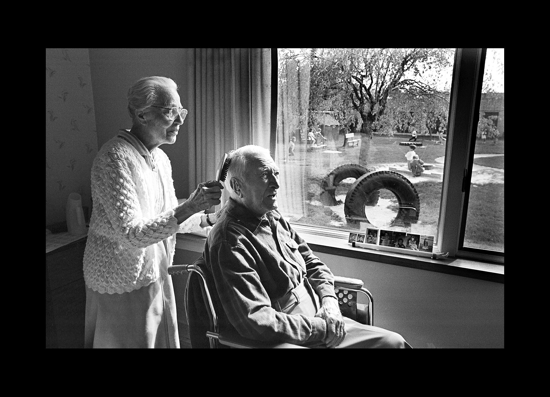  A woman brushes her husband’s hair at Messiah Village, a Christian retirement community in Mechanicsburg, Pennsylvania. 1997 