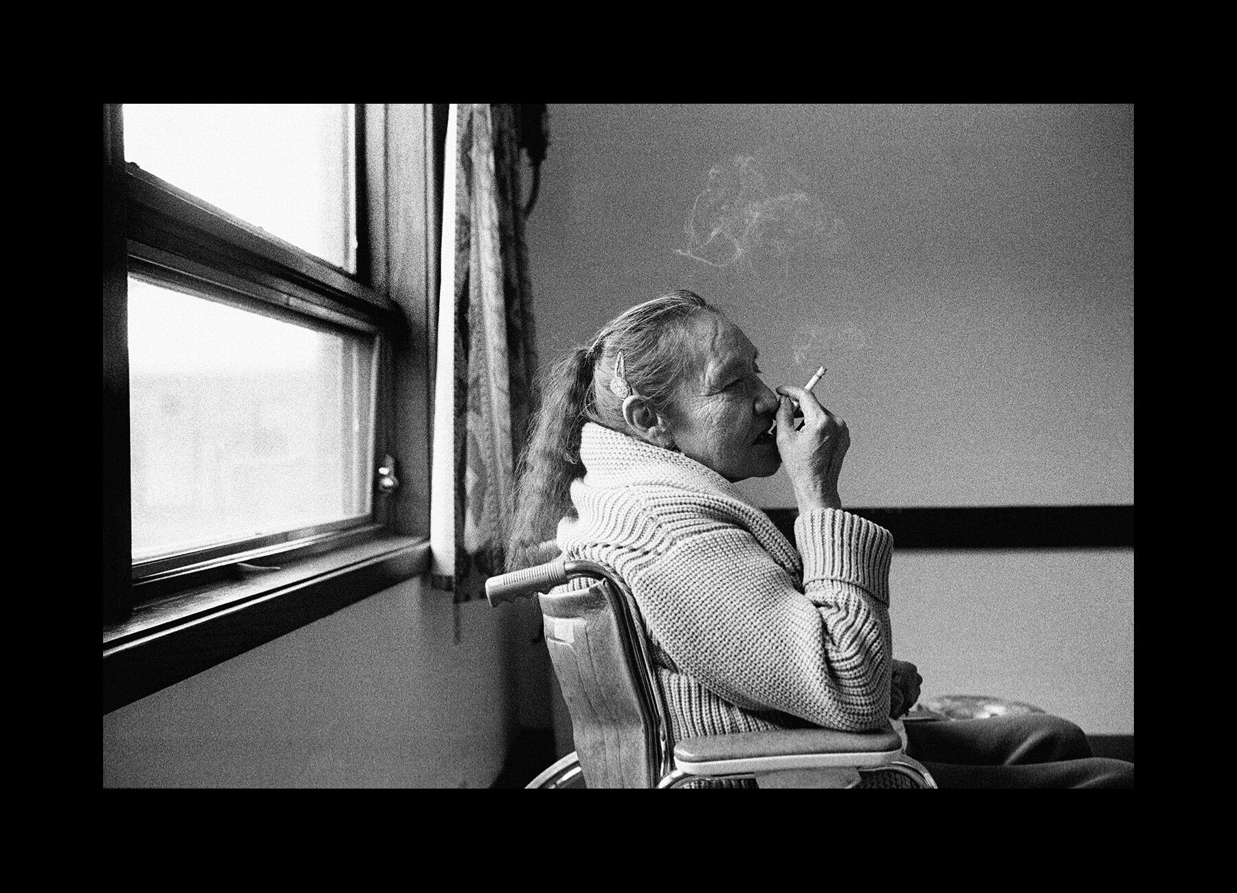  Lucille Bull Bear smokes a cigarette in a nursing home in nearby Martin, South Dakota. 2000 