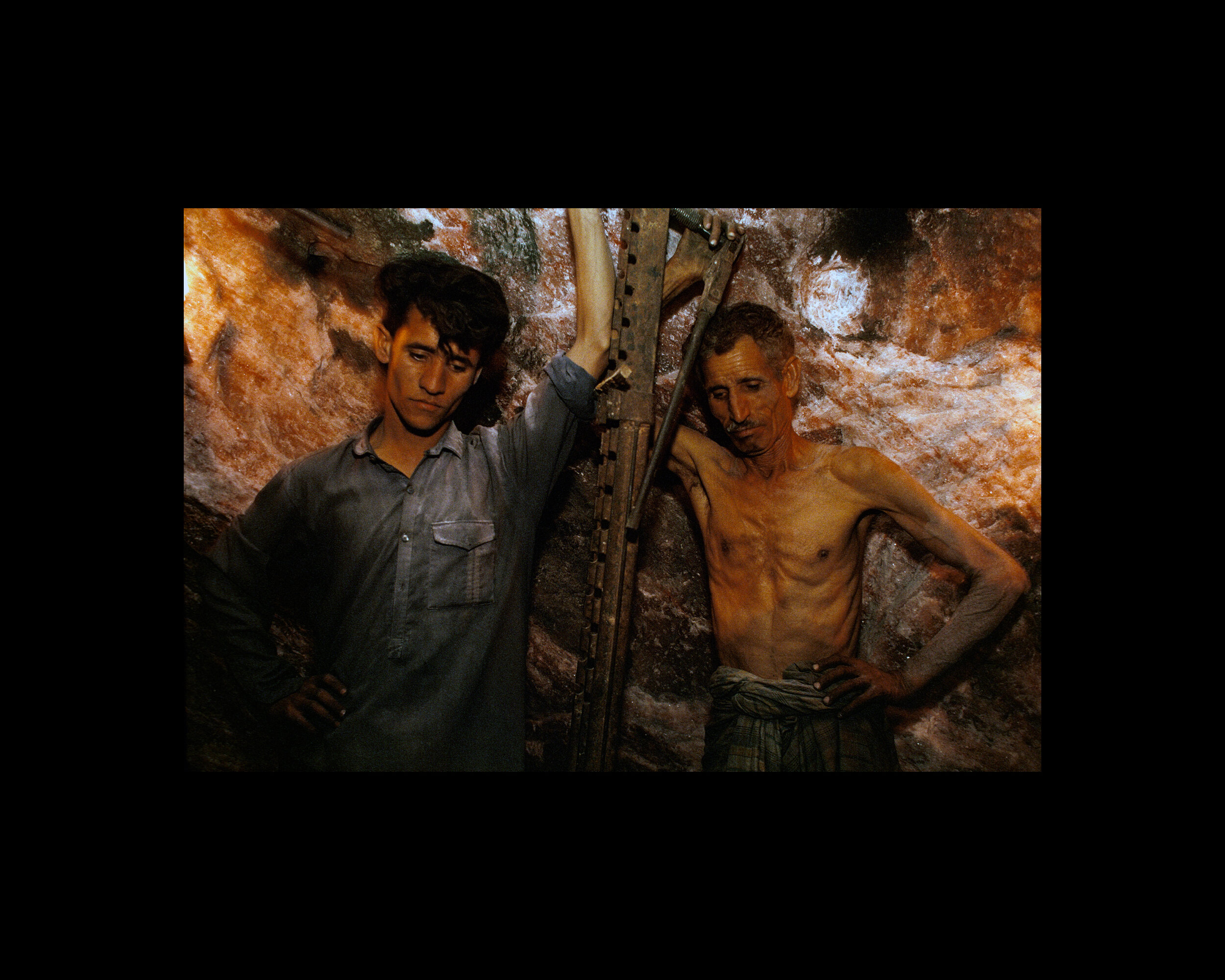  Miners manually drill holes in the Khewra Salt Mines, the oldest in the salt mining history of the sub-continent, one of the largest in Asia and the second largest in the world. Punjab, Pakistan. 1998 