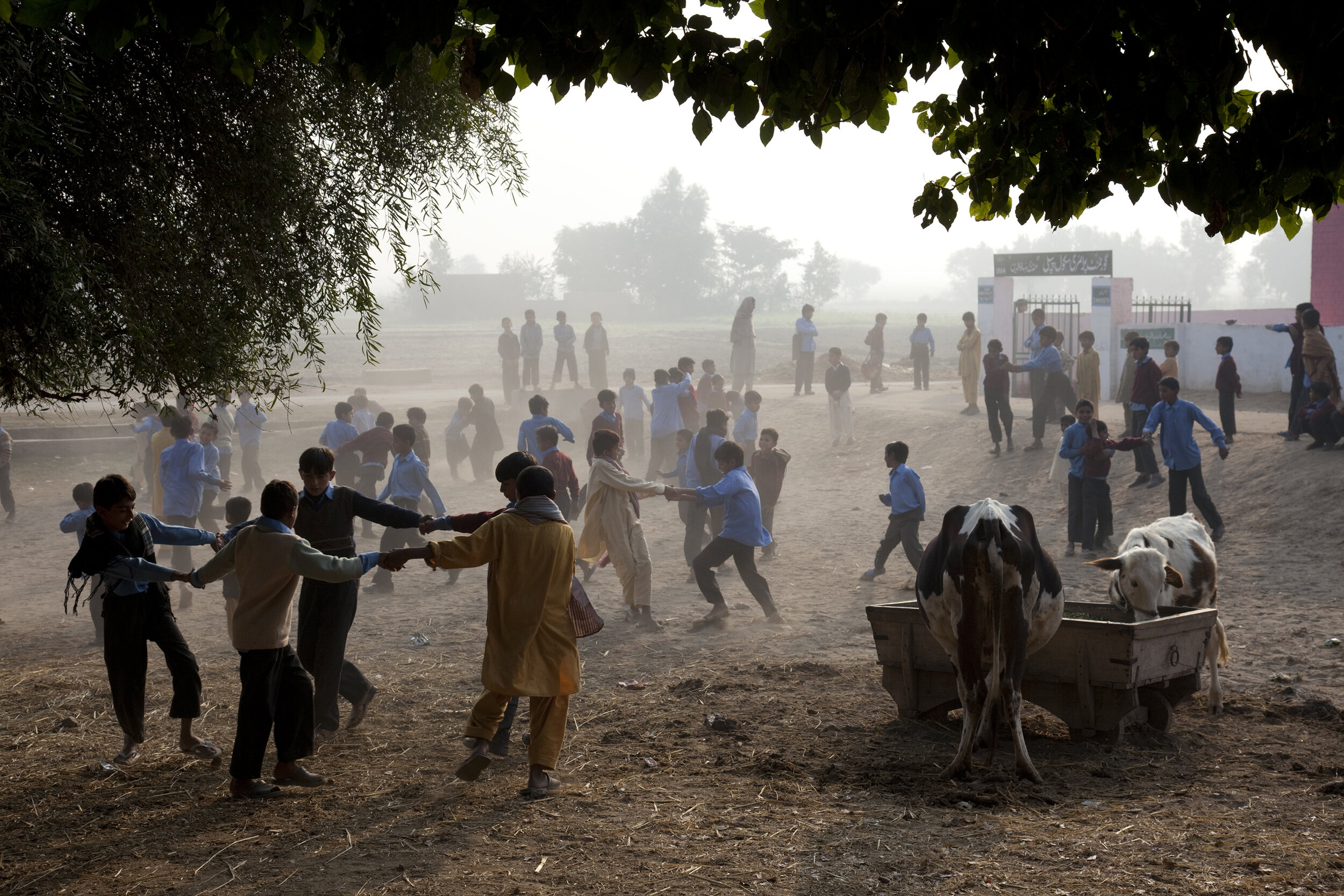  In the farming village of Pipli, schoolboys play outside their primary school before classes begin. Pakistan. 2009 