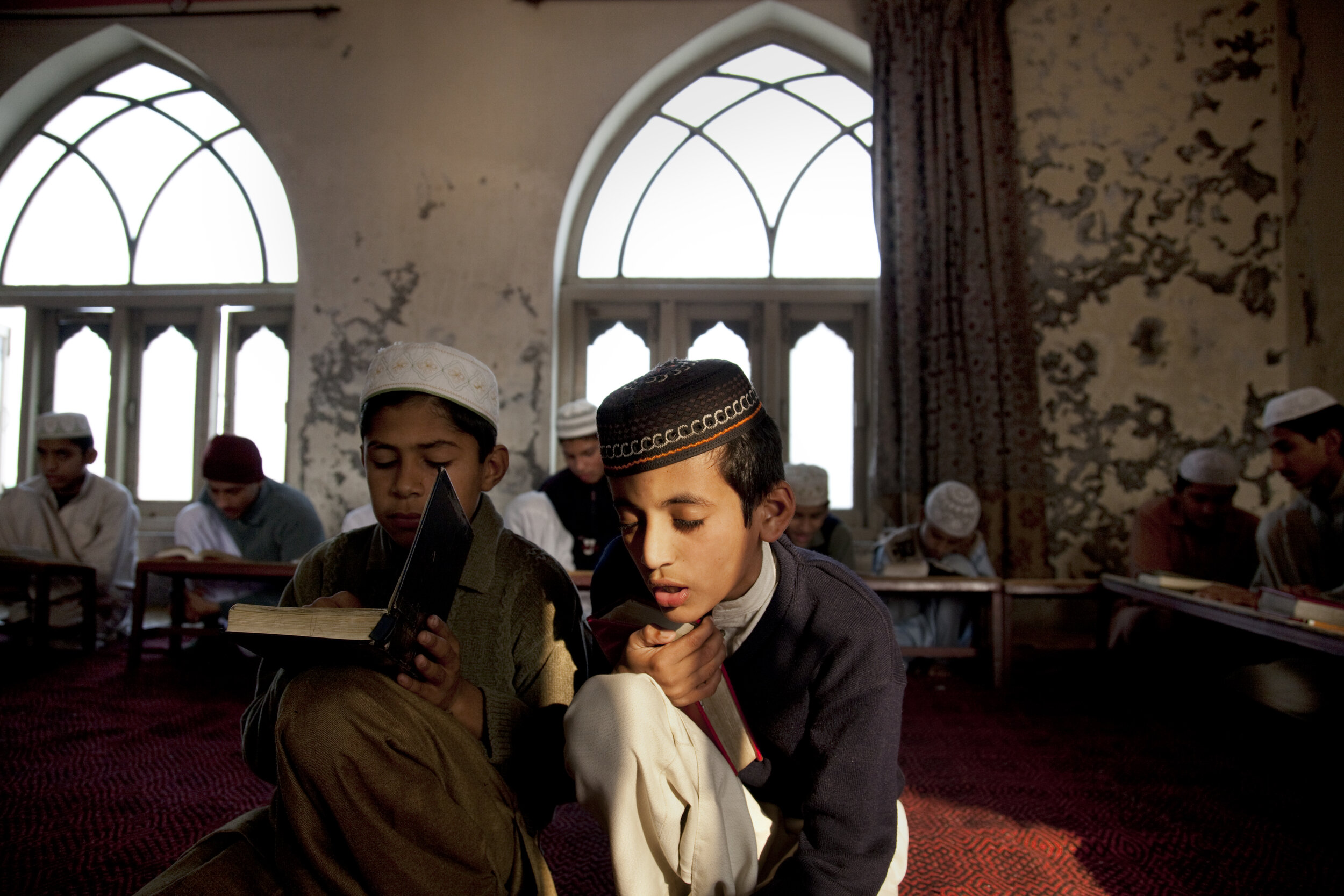  Young men study the Qu'ran at the Jamia Arabia Madrassa in Gujranwala. Pakistan. 2009  