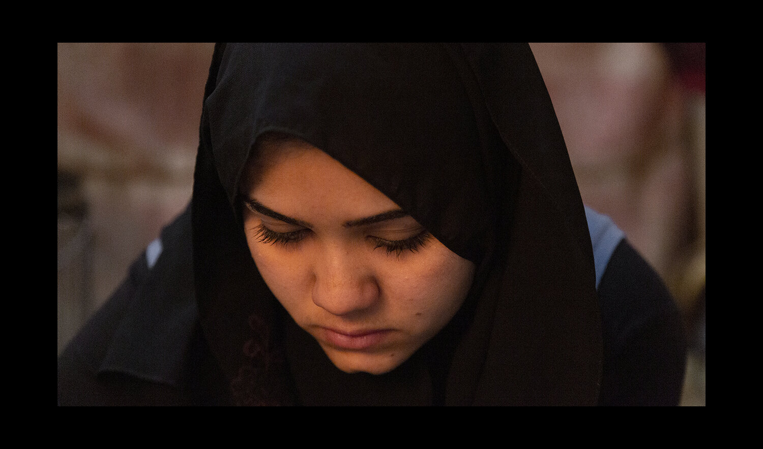  A teenager is interviewed in her family tent at the Domiz Camp for Syrian Refugees just outside of Dohuk, Iraq. Her family fled Damascus, Syria over a year prior. 2013  