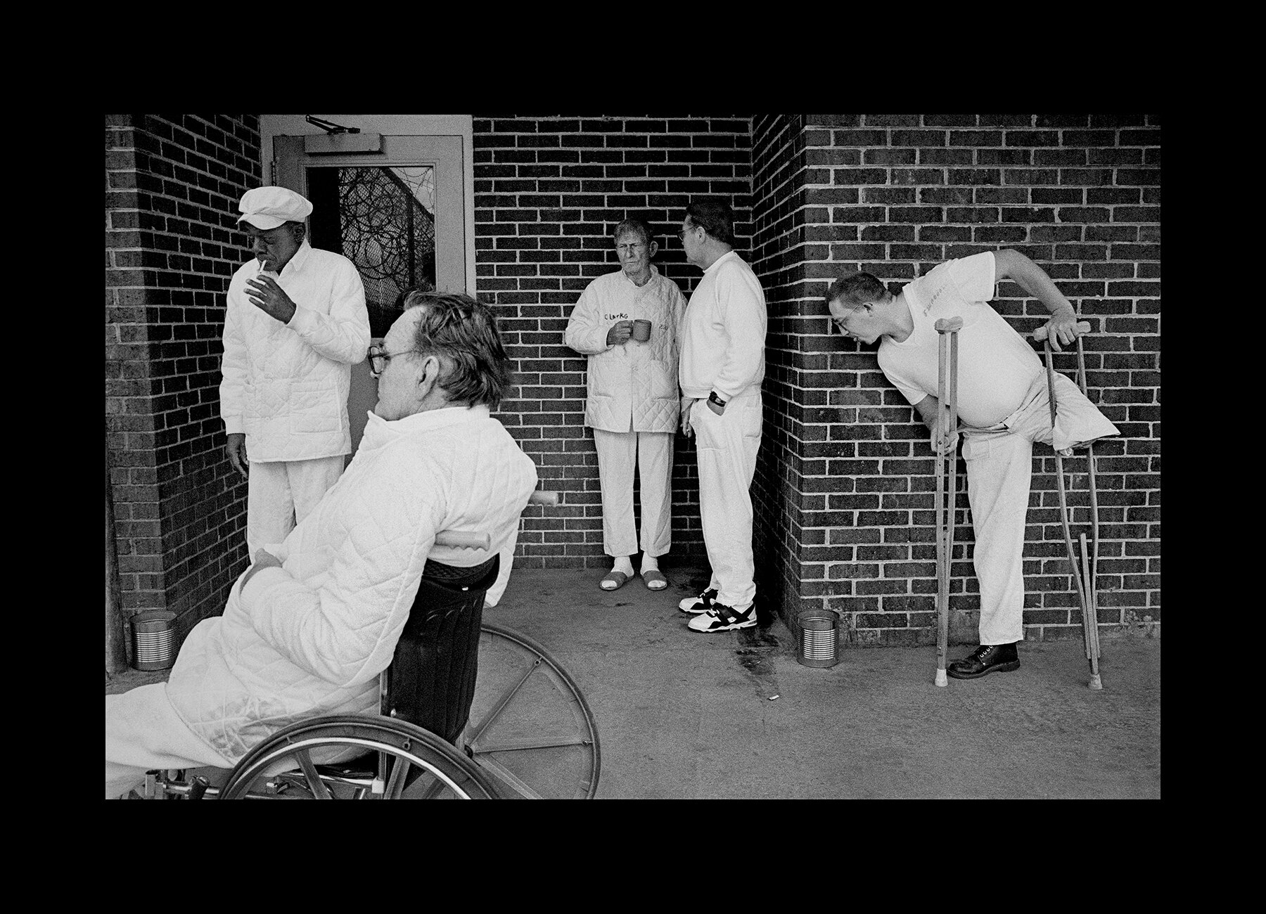 Inmates at the Hamilton Aged and Infirmed Facility gather to smoke in the designated outdoor area in Hamilton, Alabama. 1997 