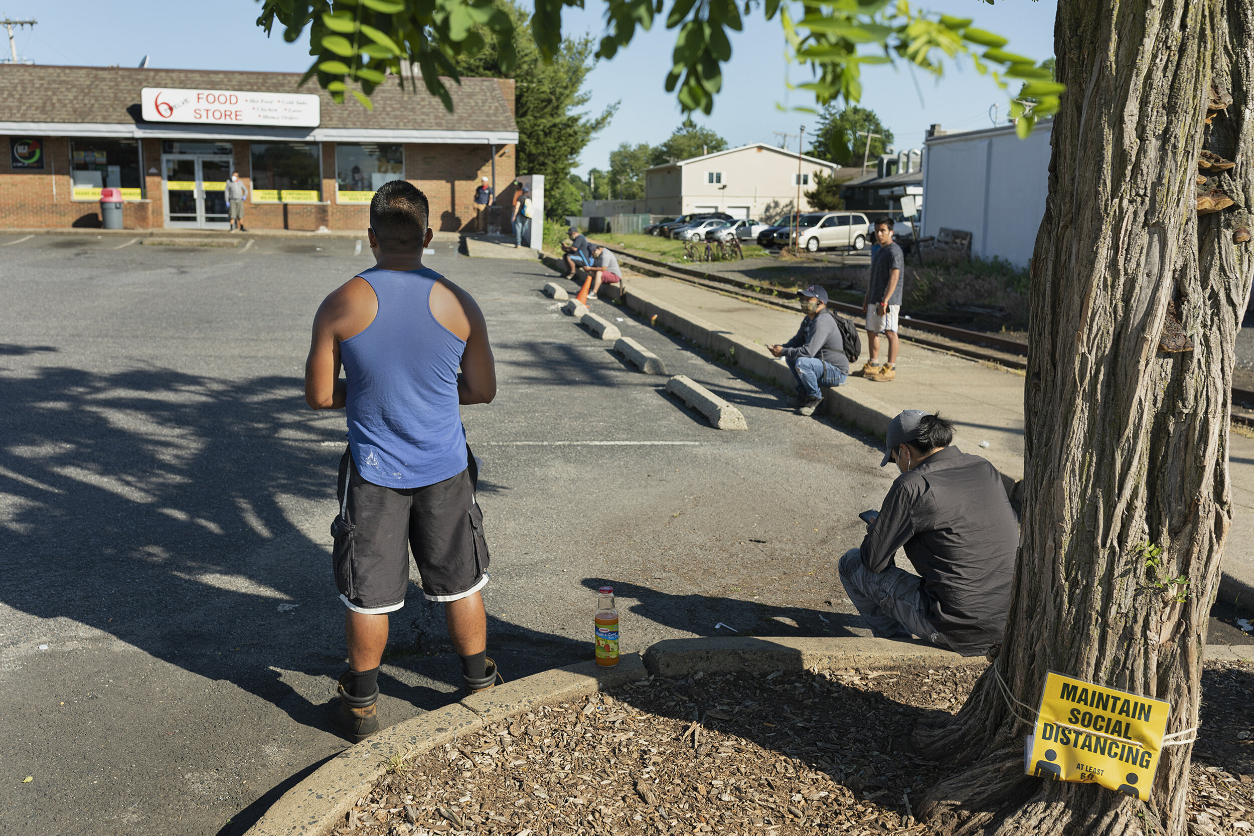  Day laborers wait for work in Freehold, New Jersey on June 9, 2020. 