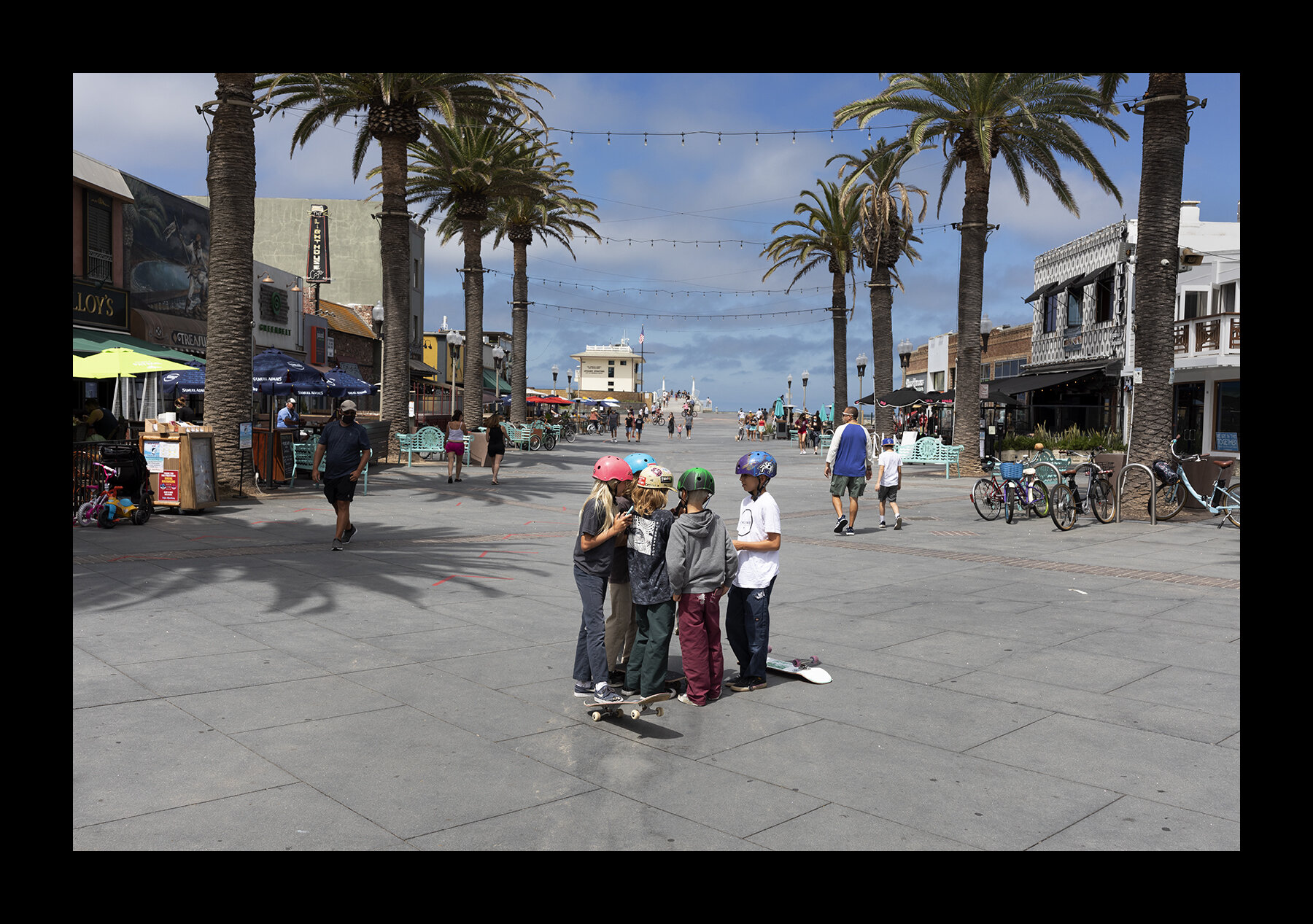  Young skateboarders hang out in Hermosa Beach, California. 