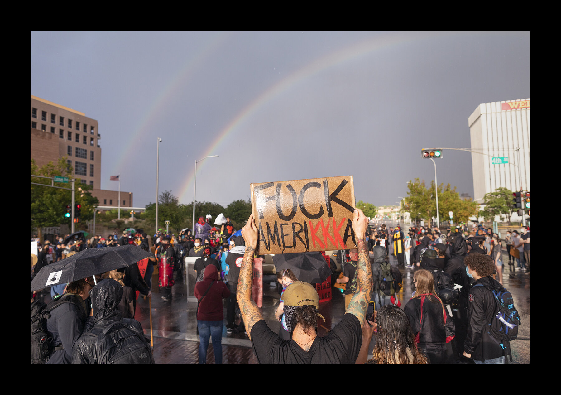  Hundreds peacefully demonstrated through a rainstorm in Albuquerque against President Trump’s plan to send federal officers to New Mexico’s largest city.  