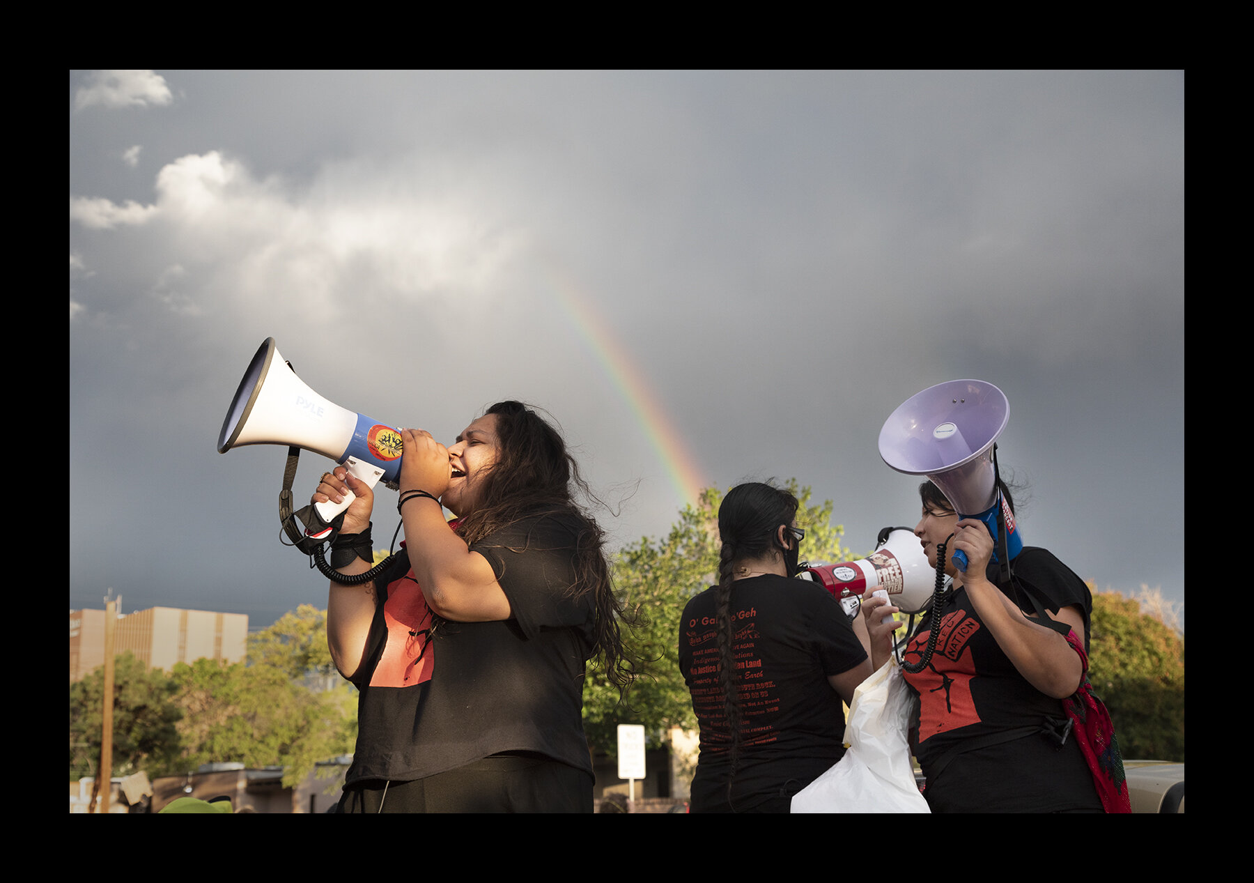  Hundreds peacefully demonstrated through a rainstorm in Albuquerque against President Trump’s plan to send federal officers to New Mexico’s largest city.  