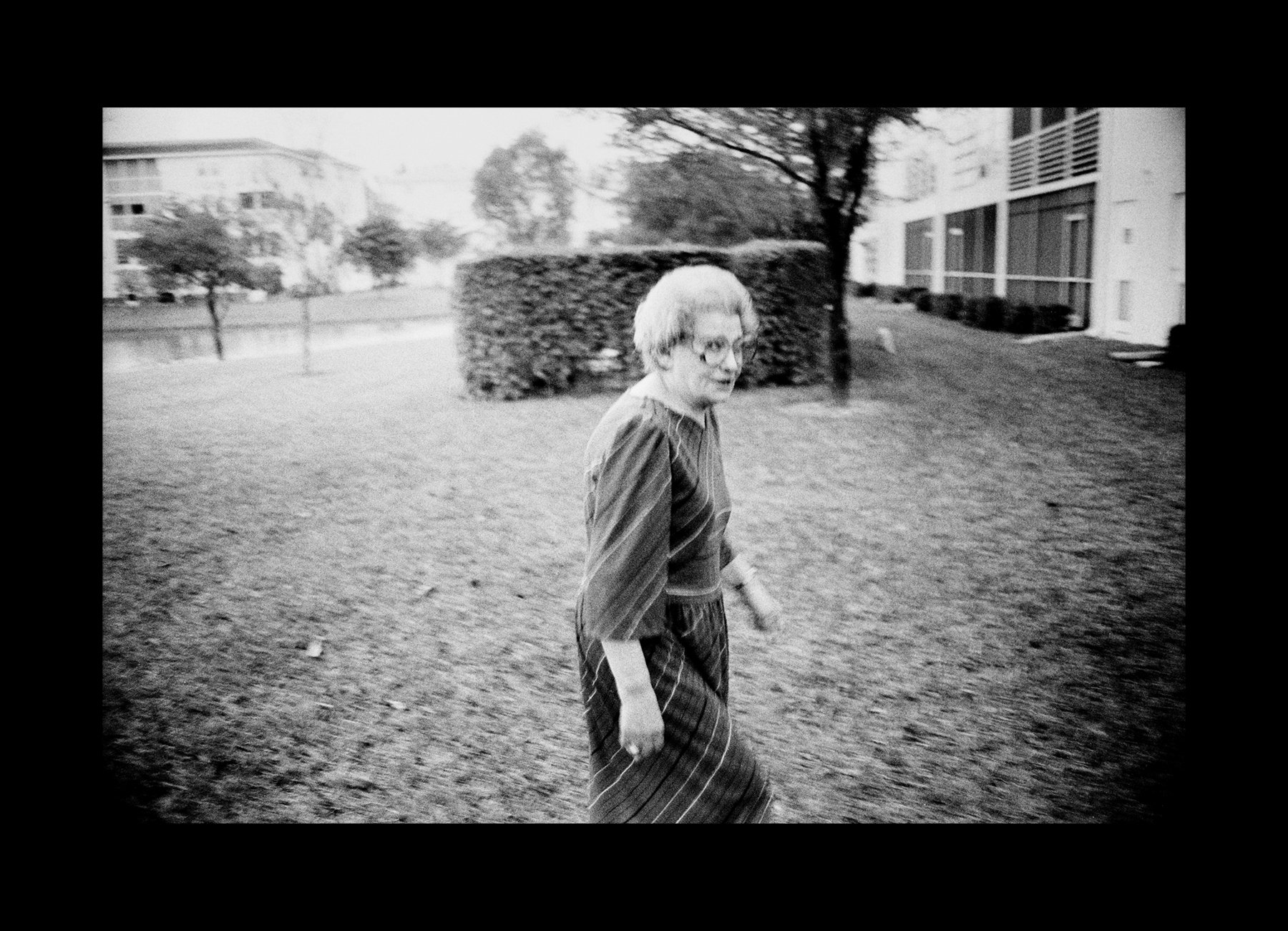   This is the last photograph I made of my mother.       Miami, Florida, USA, 1993   Doris Kashi walks outside her Miami apartment building.    