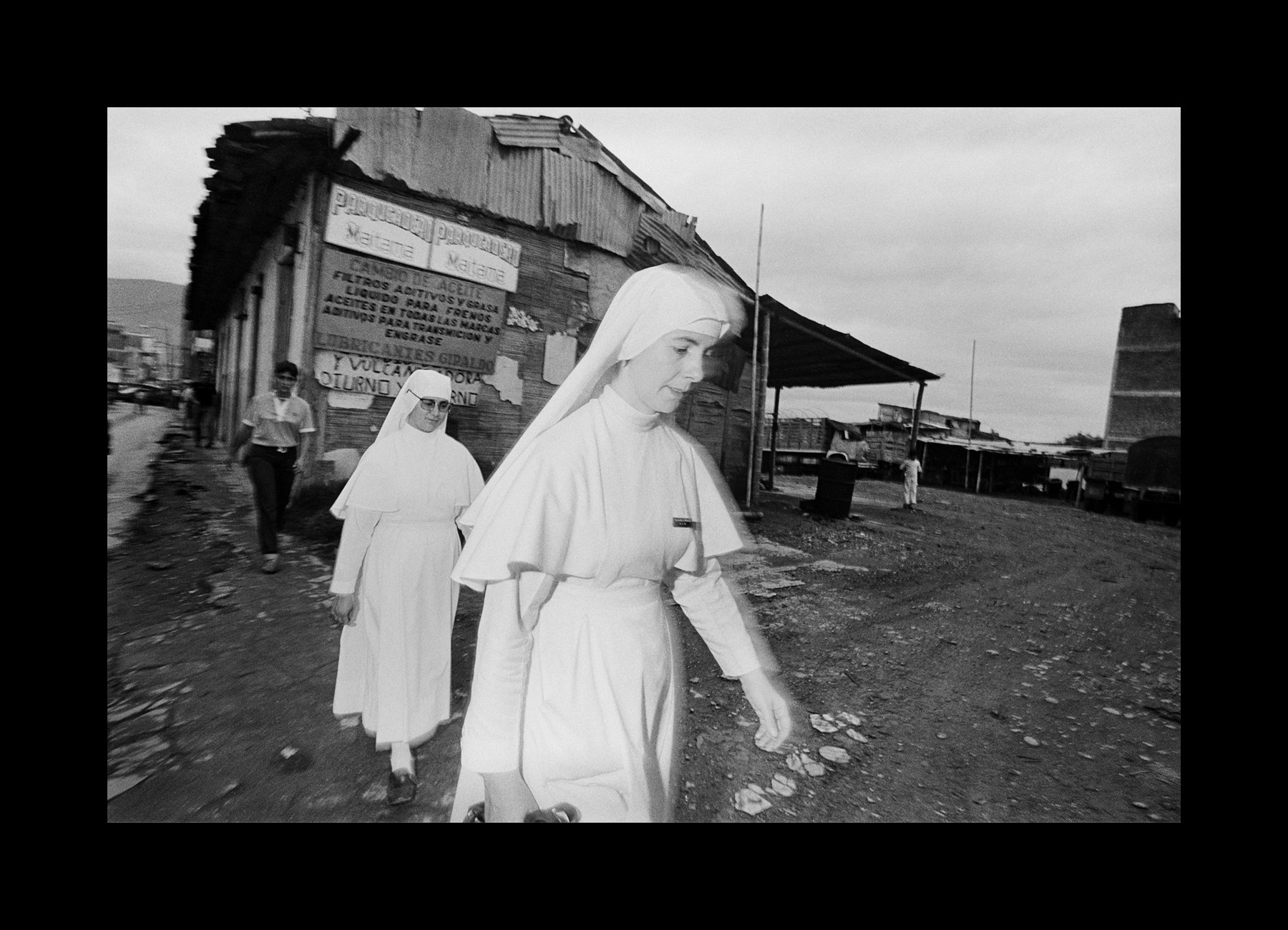    Armenia, Colombia, 1981   Nuns walk through the streets of Armenia.    
