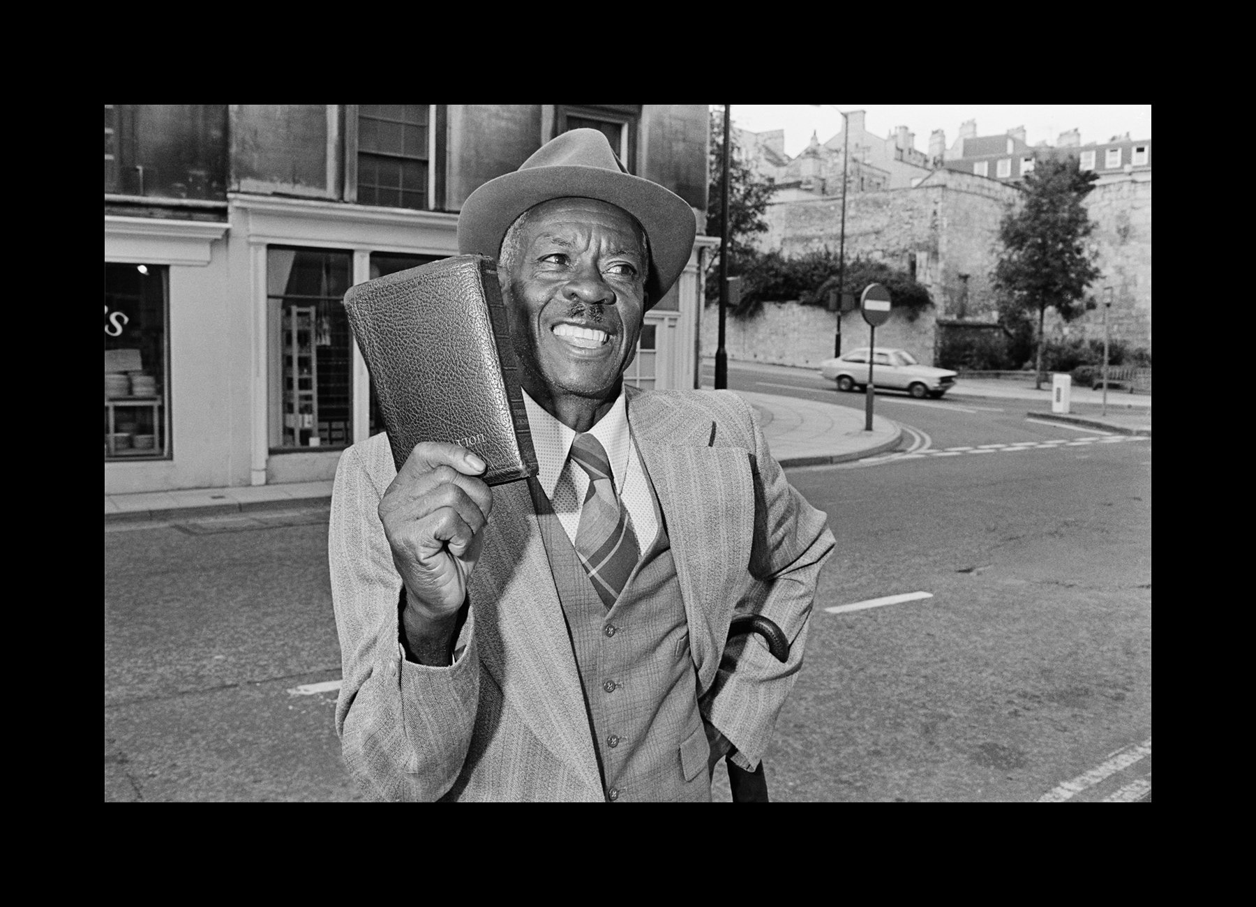    Bath, England, 1977   A Jamaican minister preaches the Bible to passersby in Bath, England.    