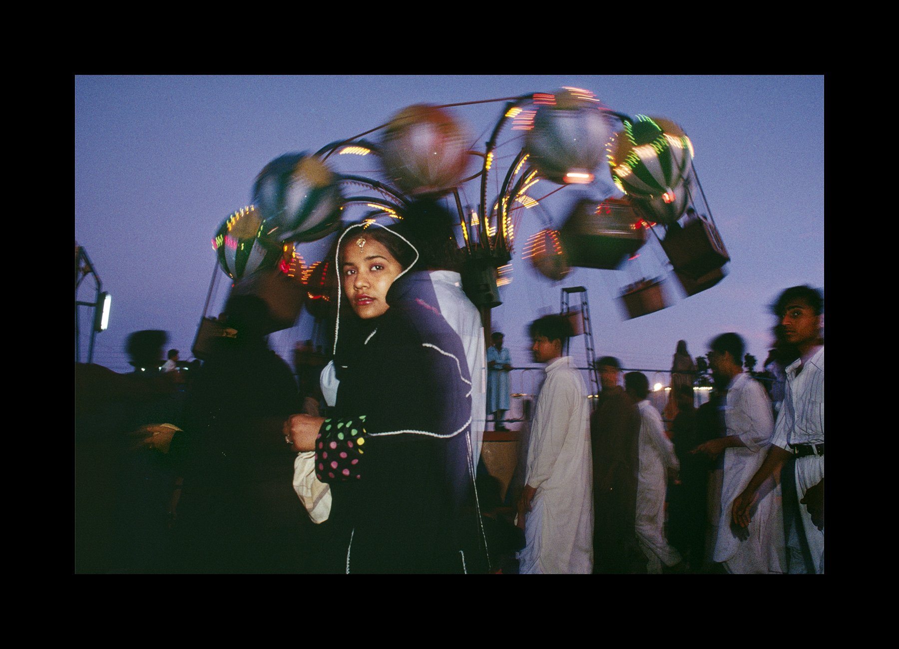    Karachi, Pakistan, 1998    Sightseers visit the colorful Clifton Beach Amusement Park in Karachi.    