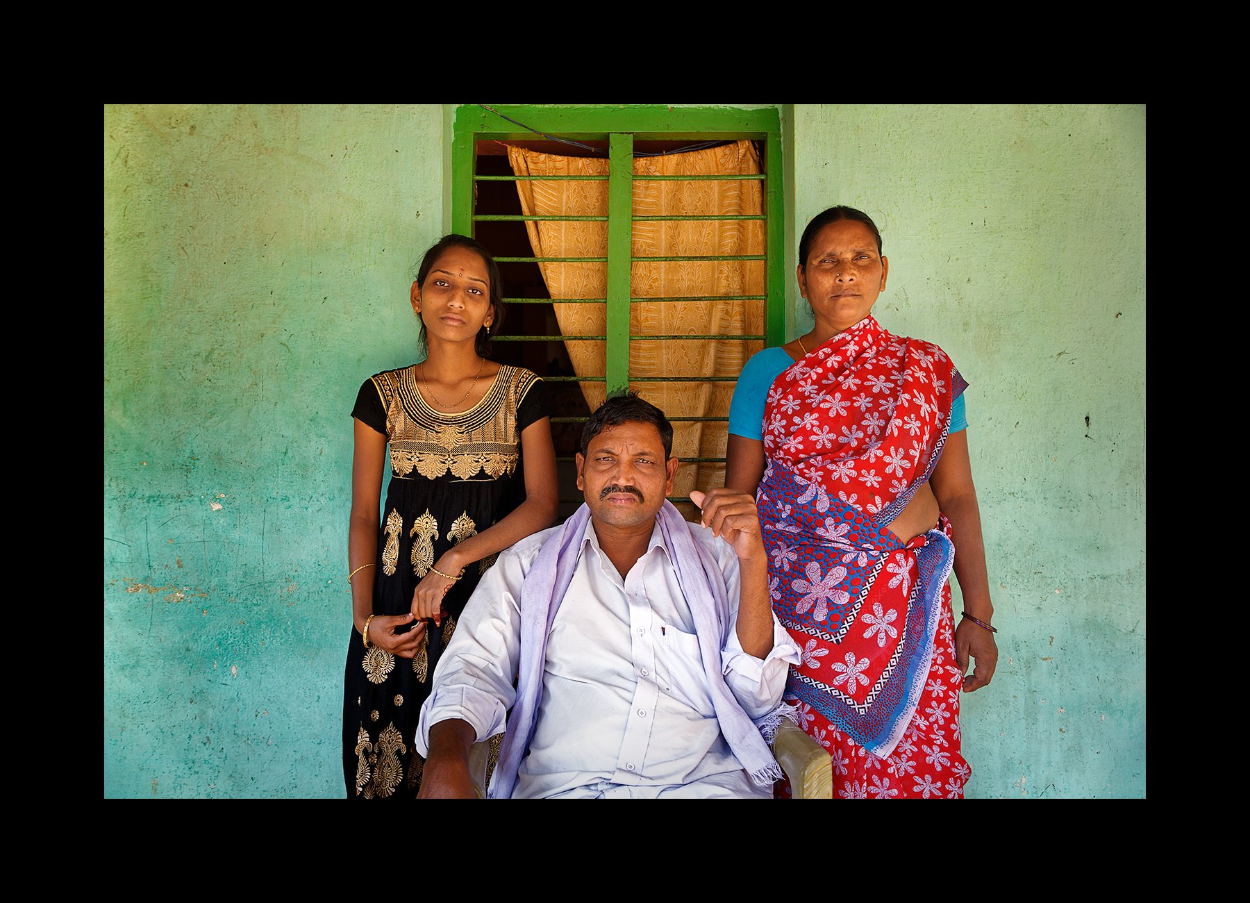  Ventkataiah, a CKDnT patient, sits for a portrait with his wife and daughter at home in the village of Kota, outside of Nellore, India on Jan. 15, 2016. 