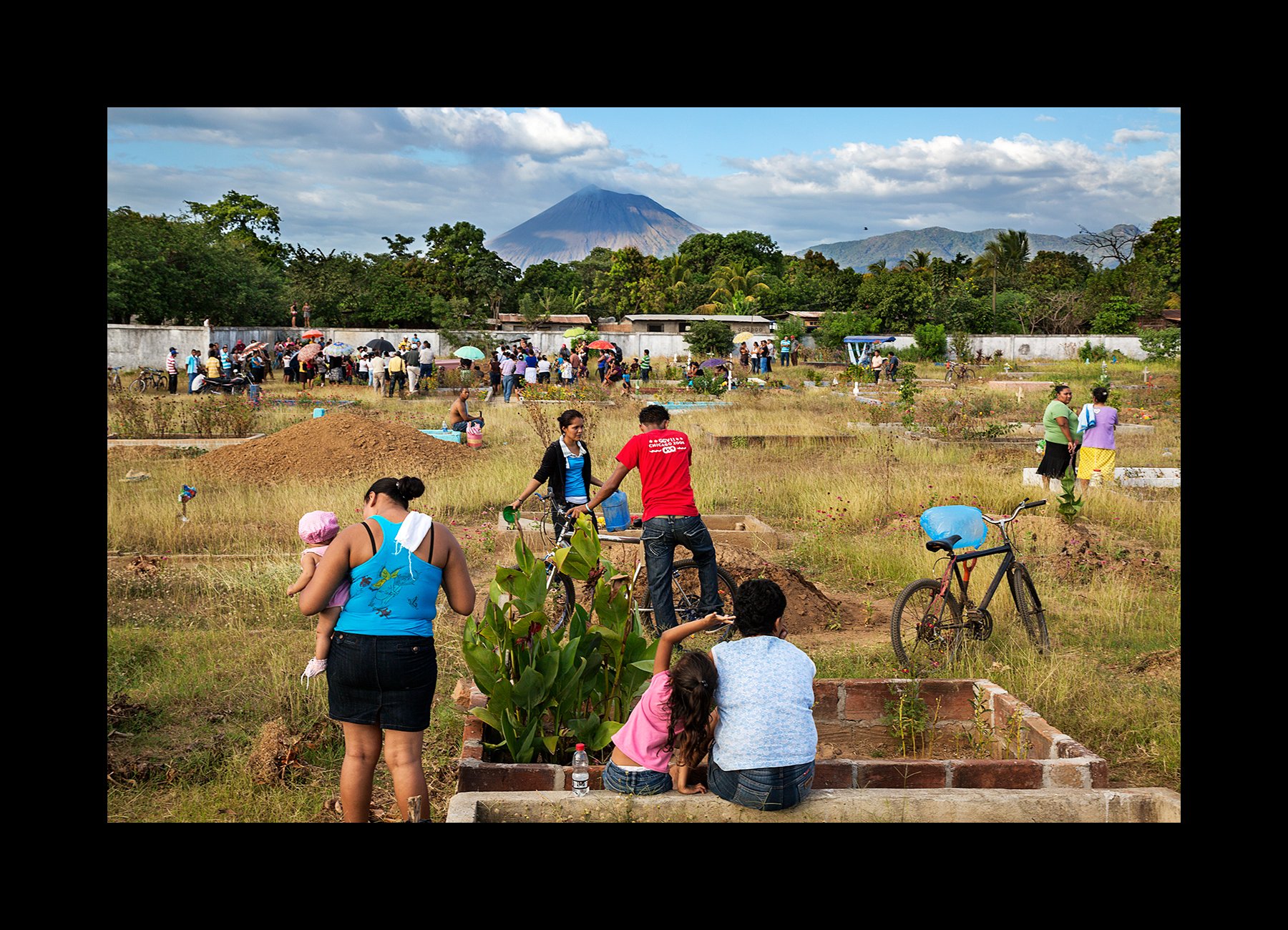 Locals gather at a cemetery where a funeral for two men who have died of chronic kidney disease are buried in Chichigalpa, Nicaragua on Jan. 6, 2013. 