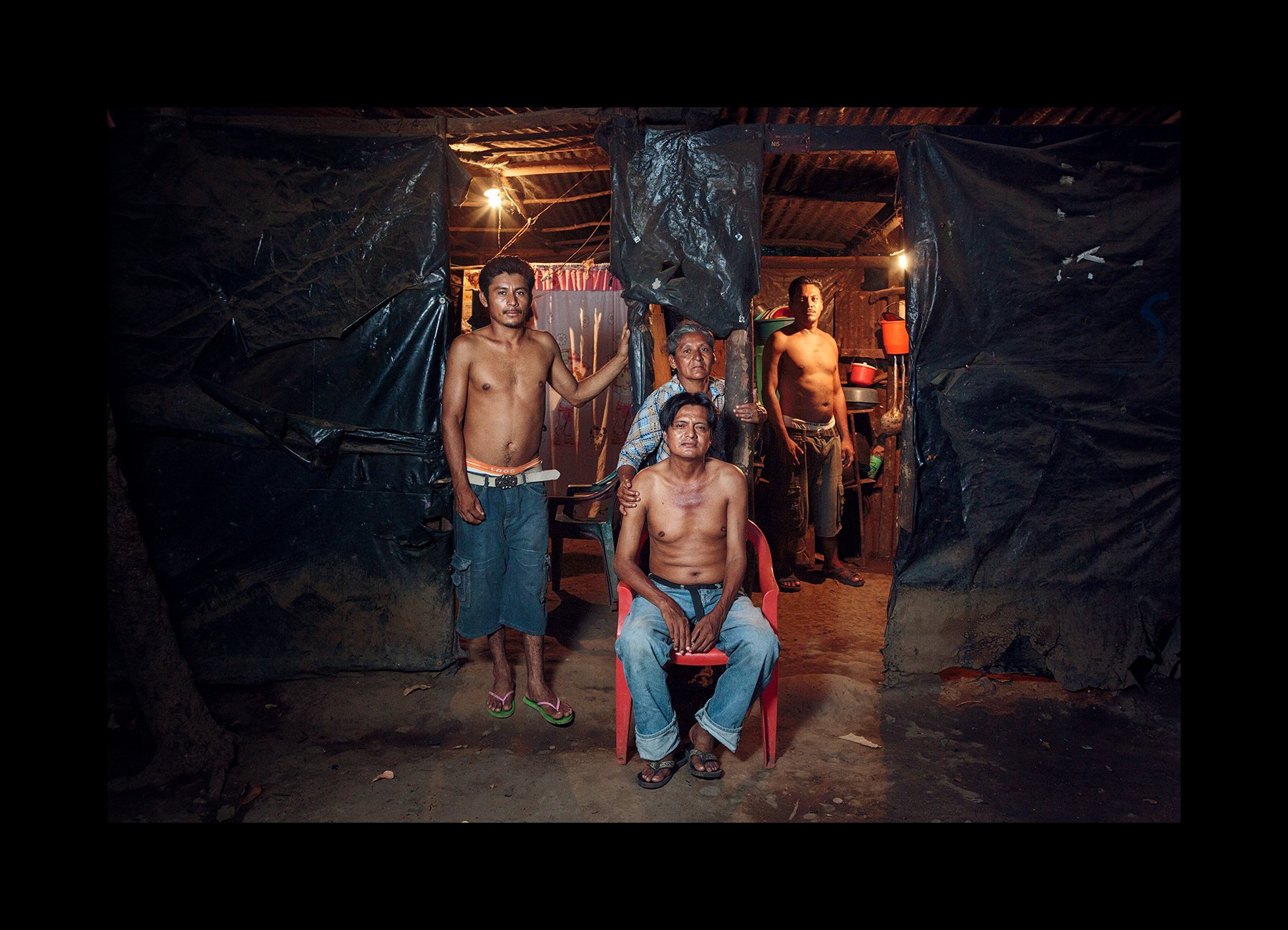  A mother poses with her husband and two sons, all former sugarcane workers who are sick with CKDnT, in Chichigalpa, Nicaragua on May 2, 2014. 