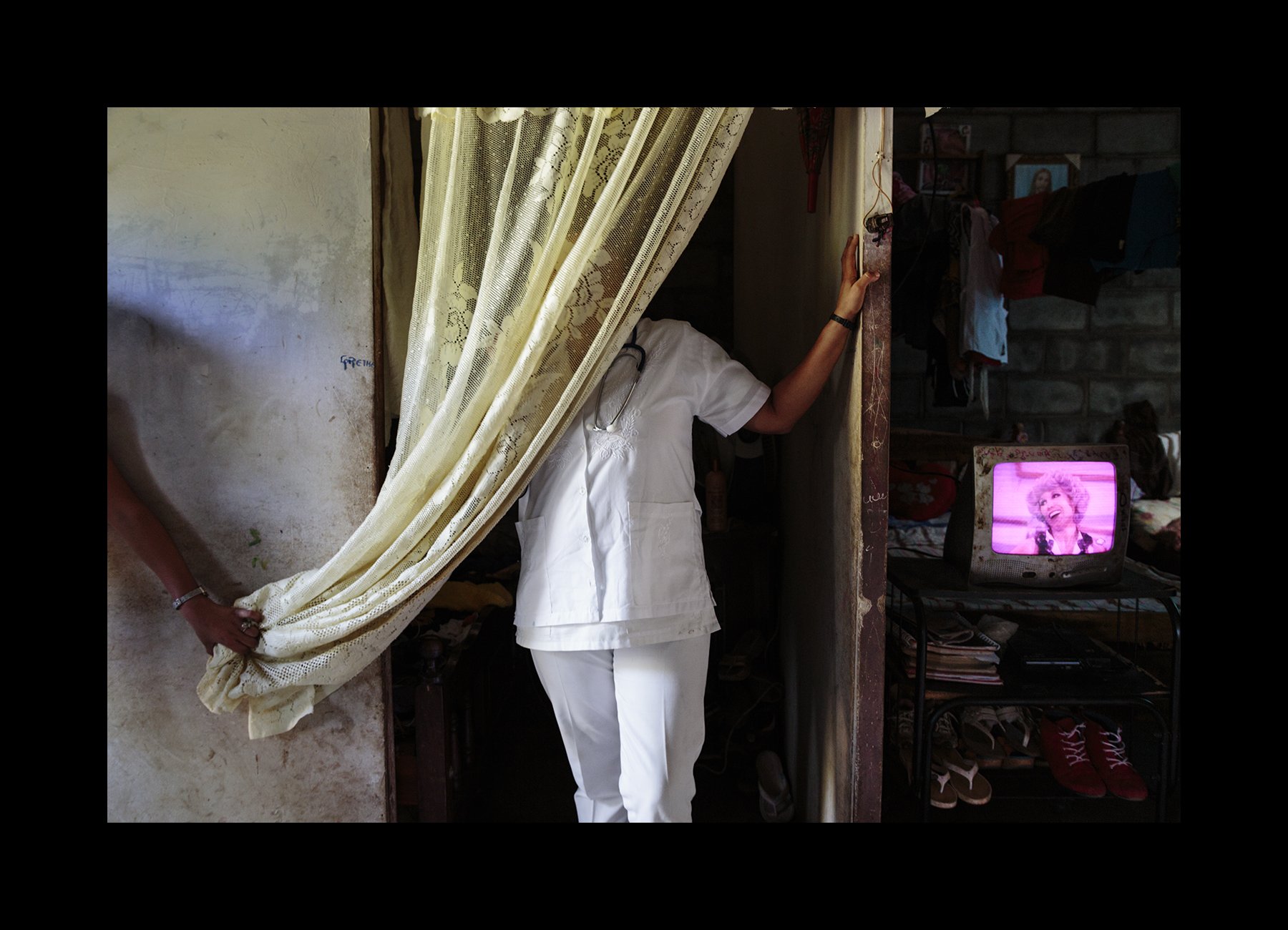  A nurse who serves many sick sugarcane workers with CKDnT, poses for a portrait at home in Chichigalpa, Nicaragua on Jan. 10, 2015. She conceals her identity because the hospital she works for does not want anyone talking to the media. 