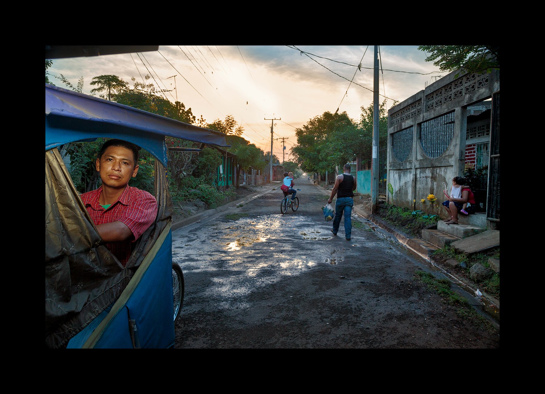  Former sugar cane worker, 31, poses for a portrait in Chichigalpa, Nicaragua on April 24, 2014. After 16 years cutting sugar cane, Valdivia is sick with kidney disease. He vows, “I’ll die working,” and now drives a tricycle taxi. 