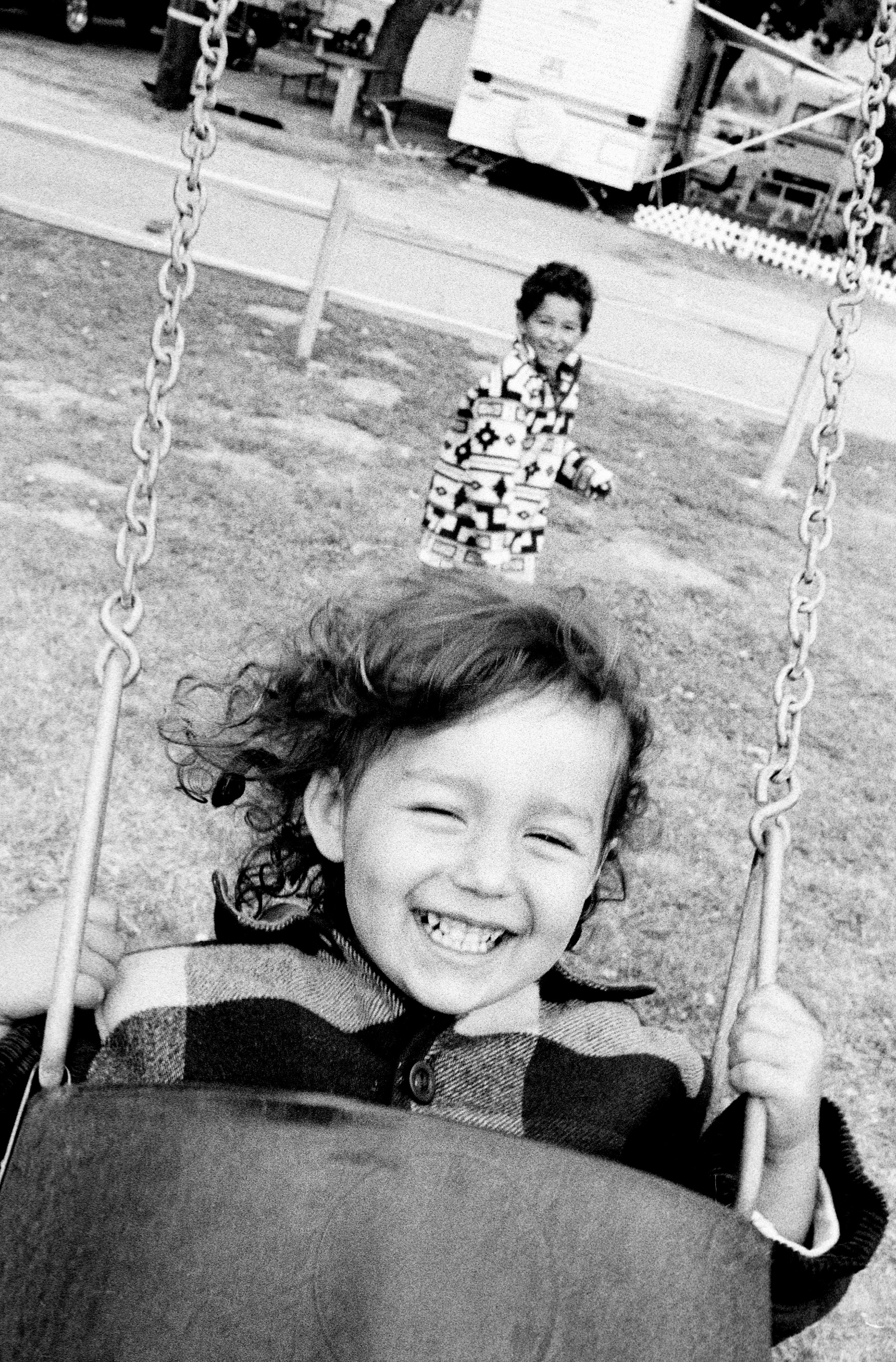  Isabel and Elijah Kashi playing on a swing set at a Joshua Tree camp site. 2000 